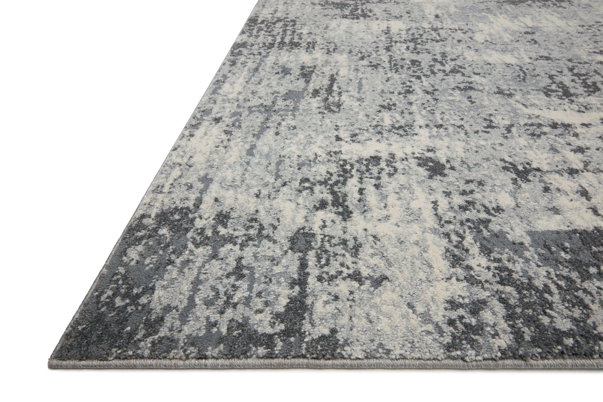 side view of Austen Pebble / Charcoal luxury Rug