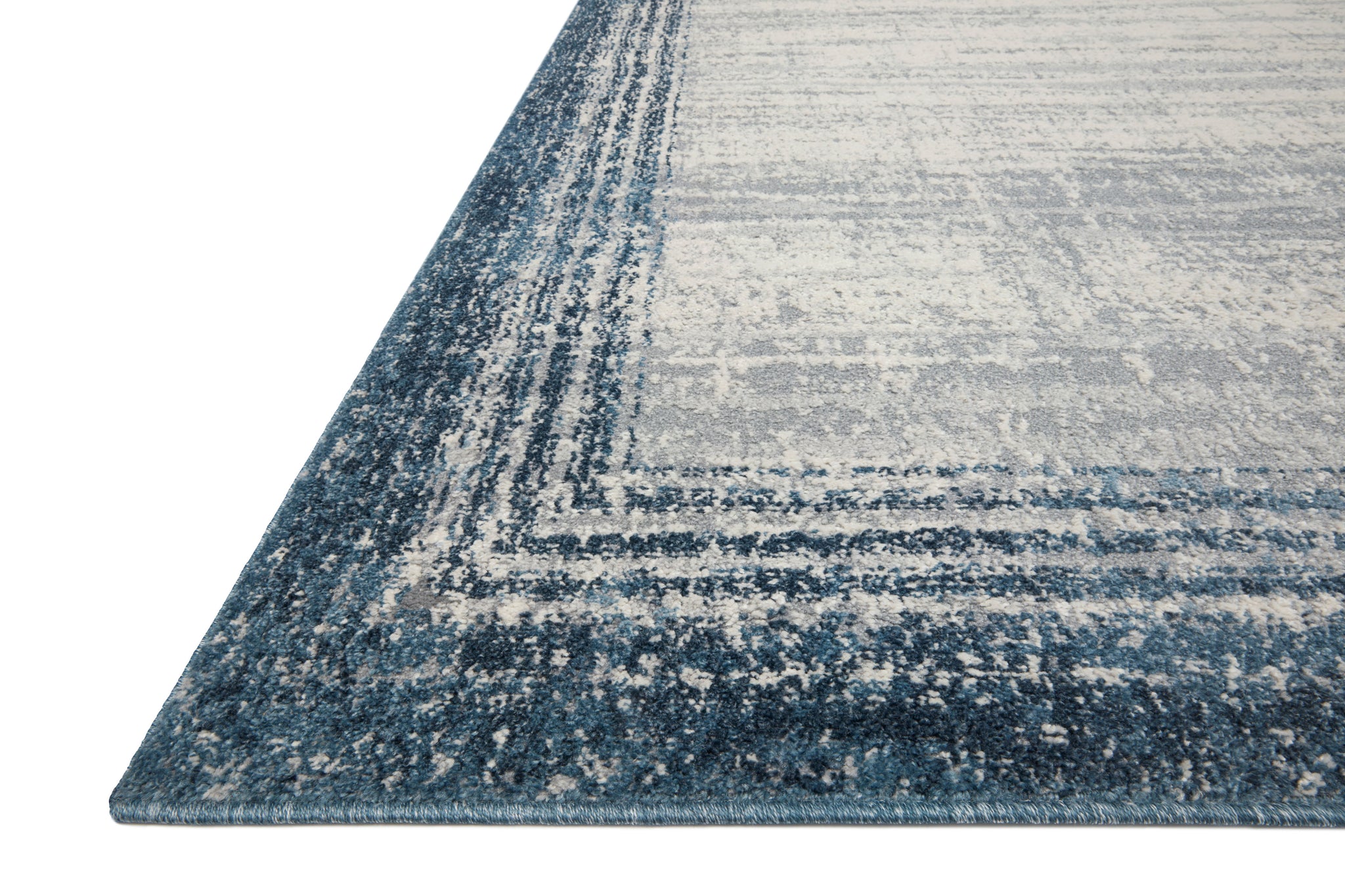 side view of Austen Pebble / Blue luxury Rug