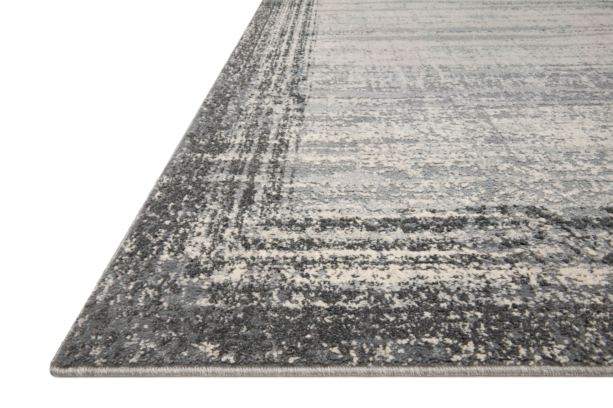 side view of Austen Pebble / Charcoal luxury Rug