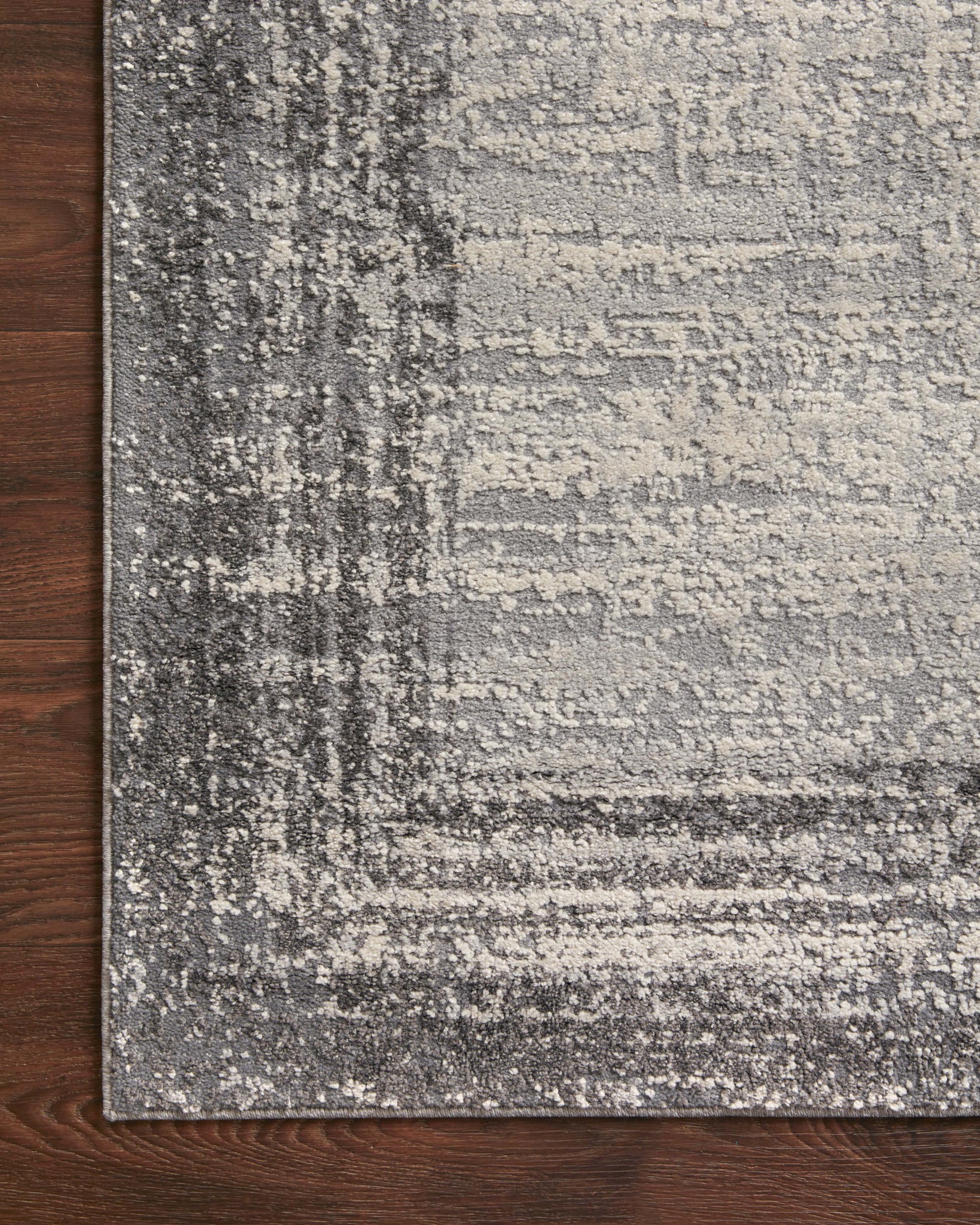 lifestyle view of Austen Pebble / Charcoal luxury Rug