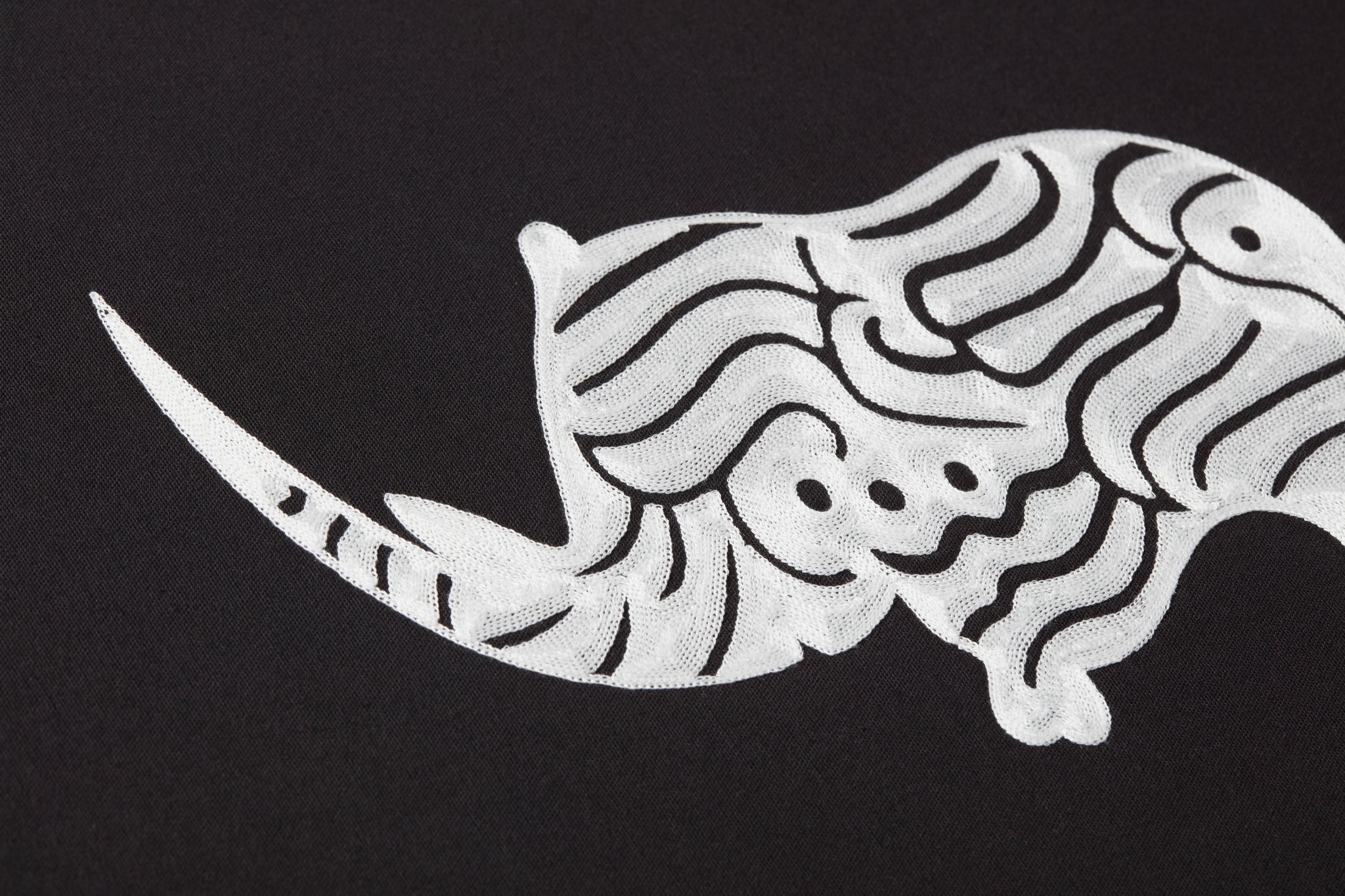 side view of Kifaru Black / Ivory luxury Artwork