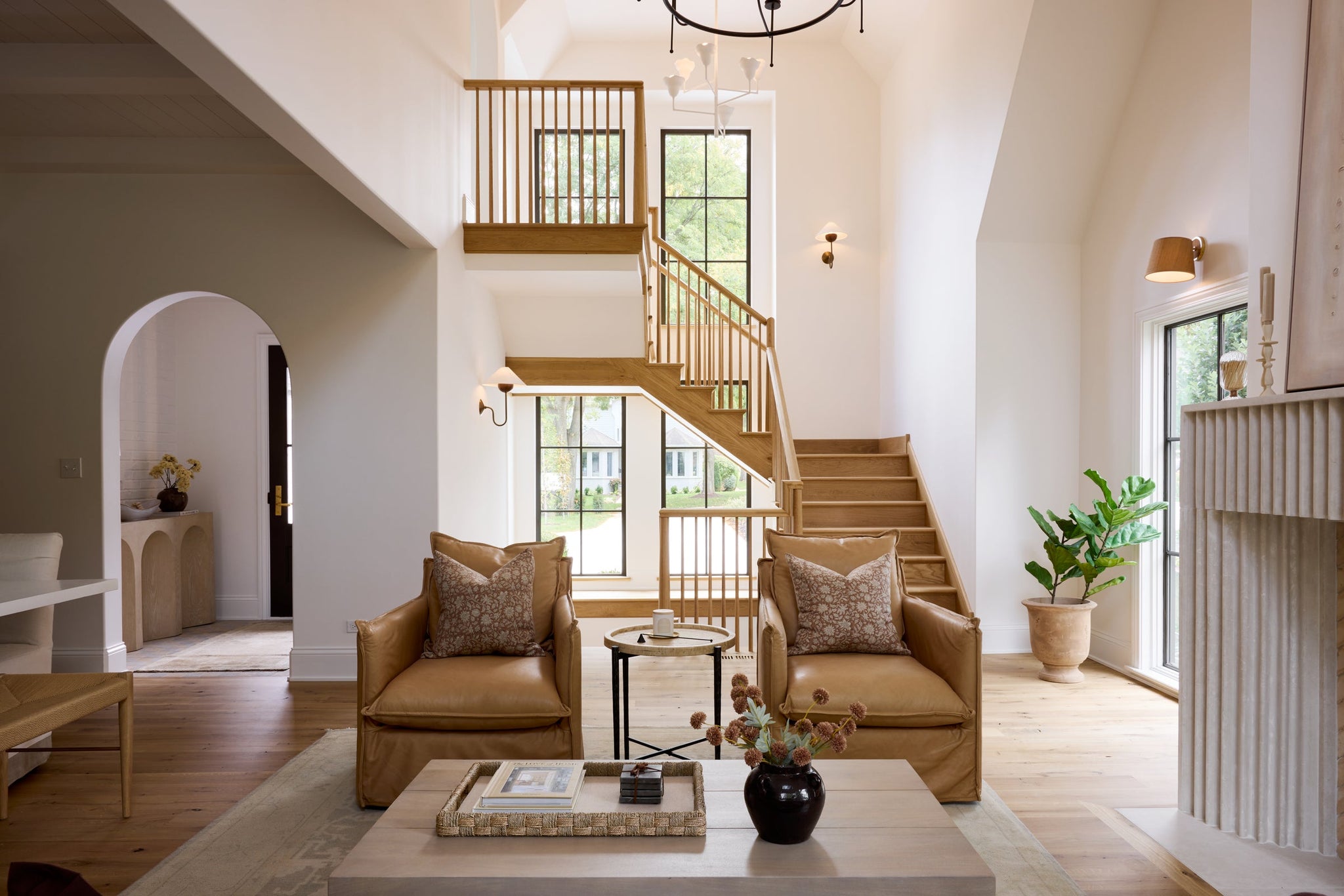 Evan Wall Sconce styled in a warmly lit hallway for warm, layered light at Laurie Yapp Home.