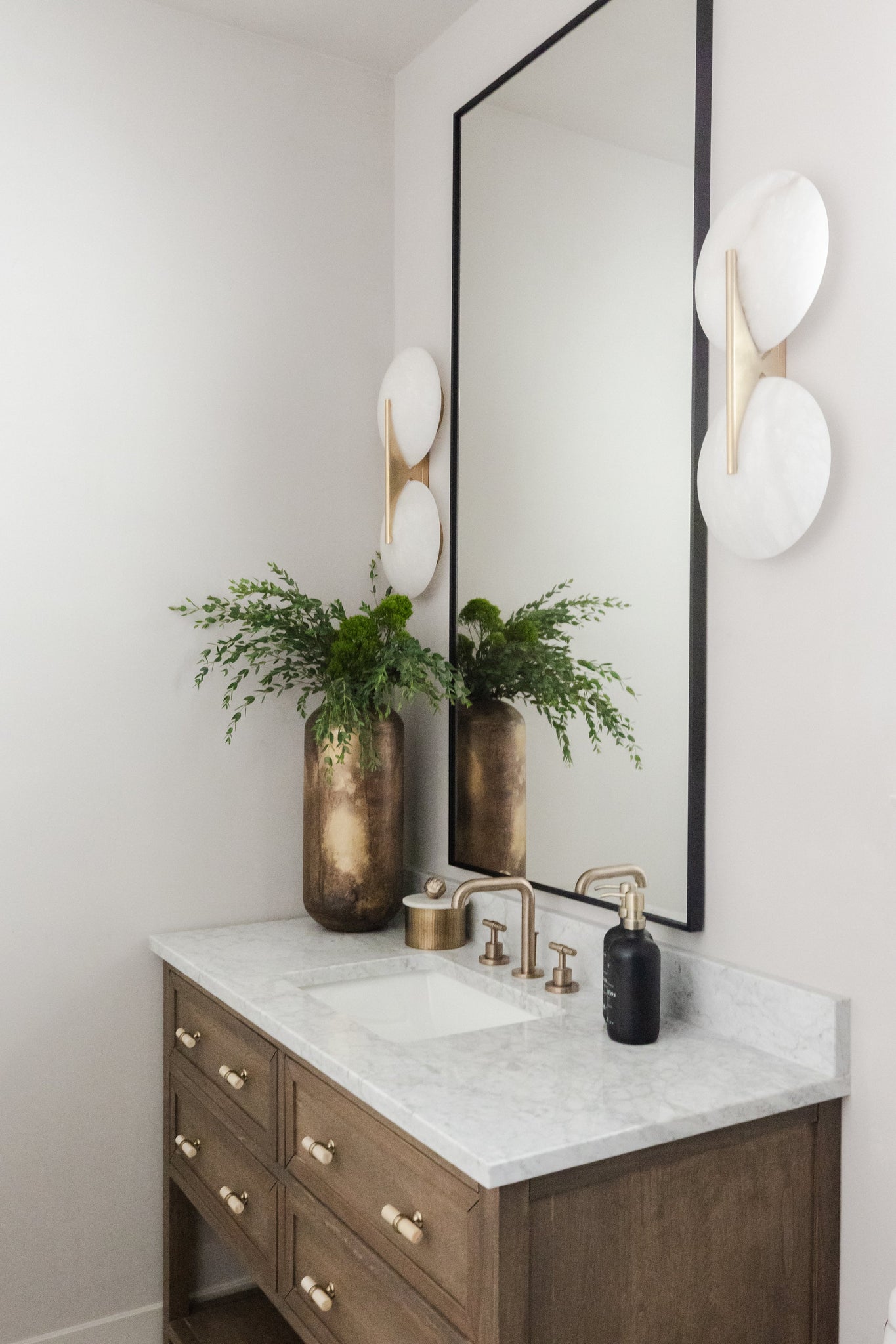 Asteria Wall Sconce 9.75" x 20.75" styled in a curated living room for warm, layered light at Laurie Yapp Home.