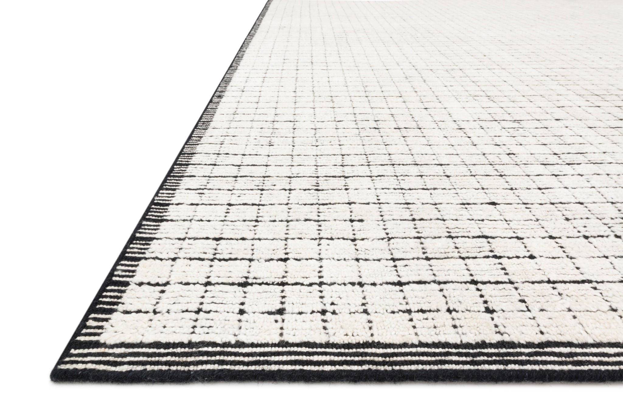 side view of Beverly Ivory / Black luxury Rug