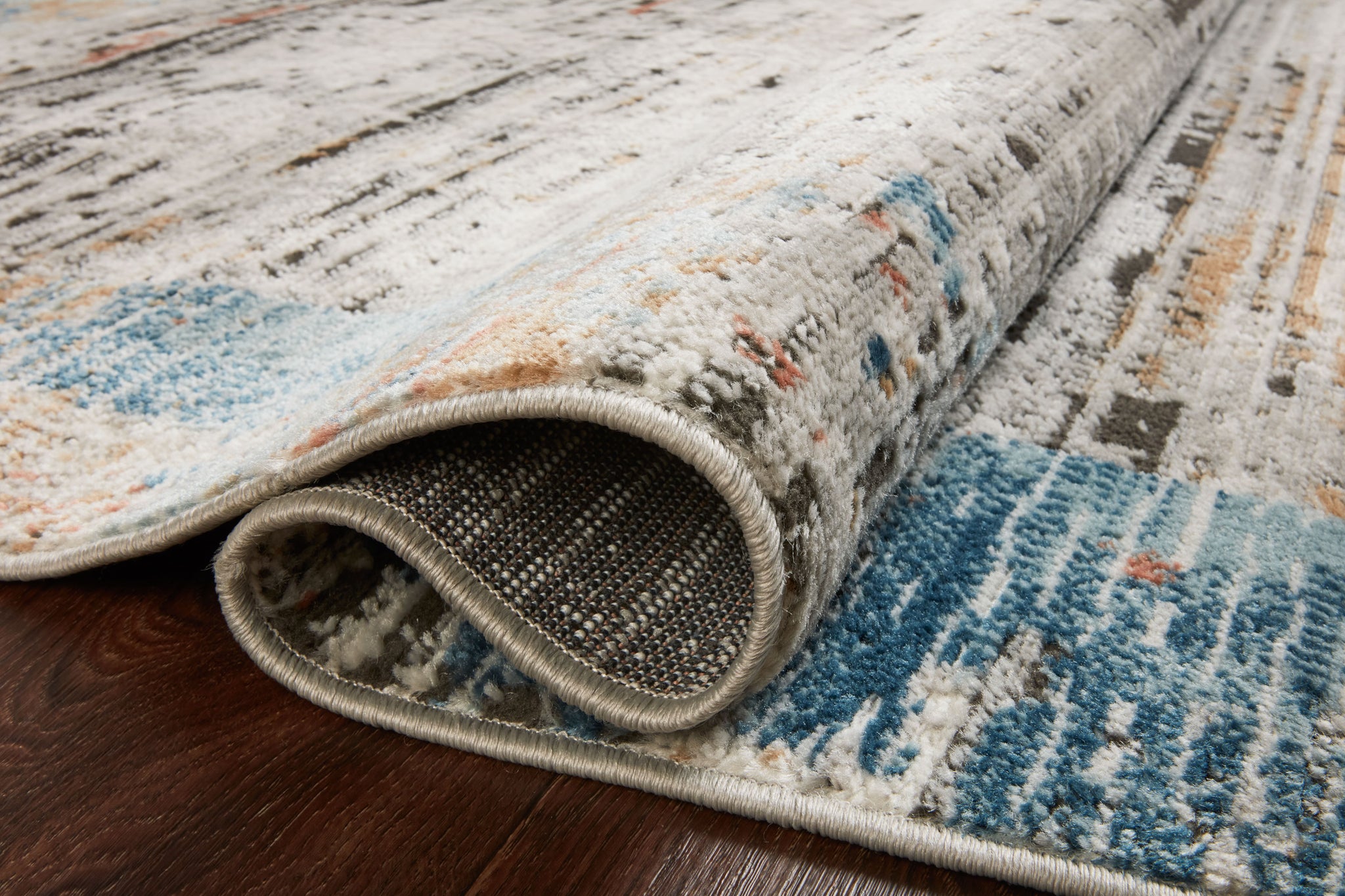 side view of Bianca Ash / Multi luxury Rug