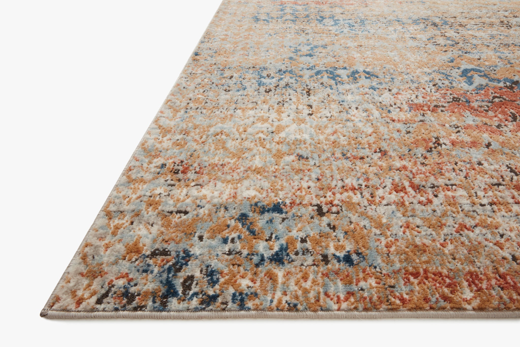side view of Bianca Ocean / Spice luxury Rug