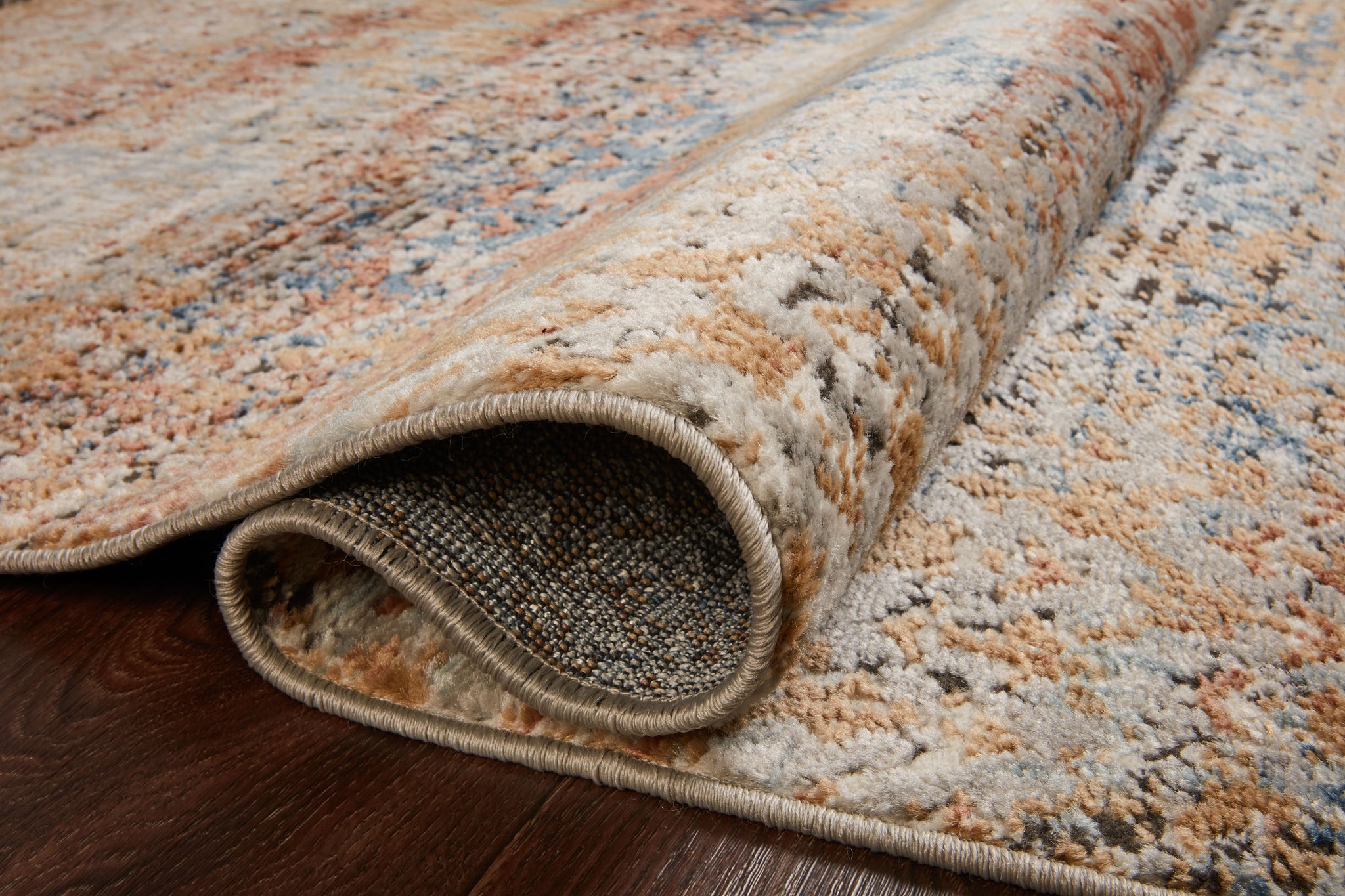 angle view of Bianca Ocean / Spice luxury Rug