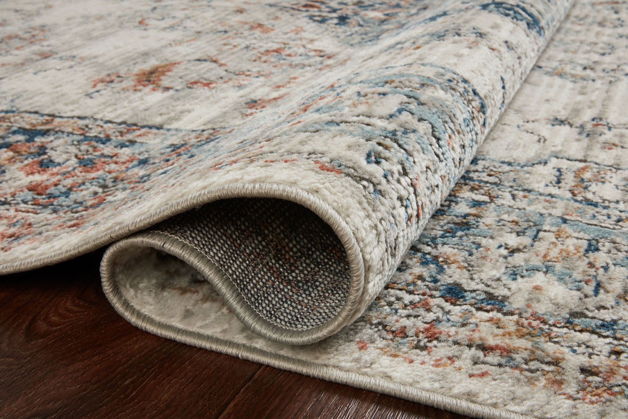 side view of Bianca Ivory / Ocean luxury Rug
