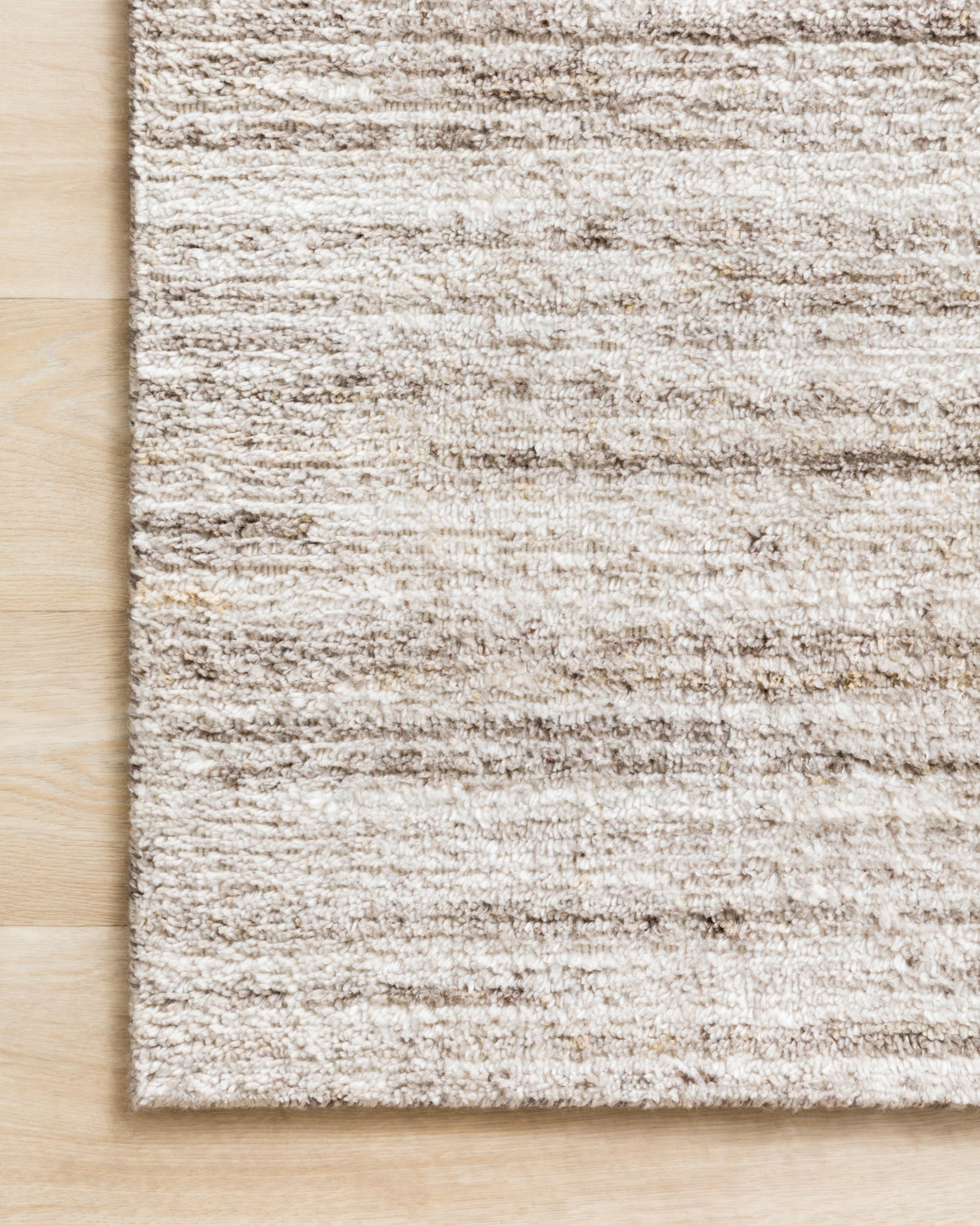 side view of Brandt Ivory / Oatmeal luxury Rug