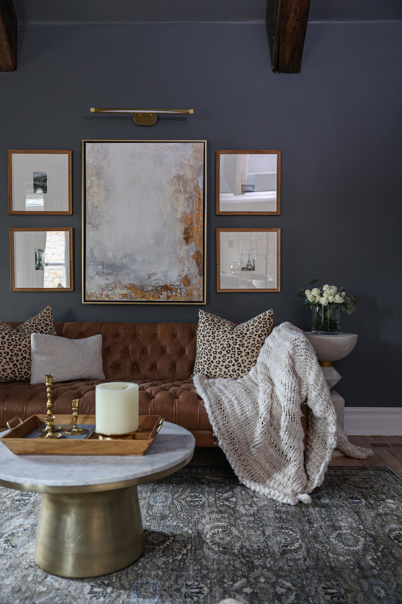 Berkshire Picture Light 37" in aged brass styled in a reading room for warm, layered light at Laurie Yapp Home.