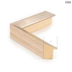 Wood and metal frame corner sample, featuring a light wood finish with a metallic edge.