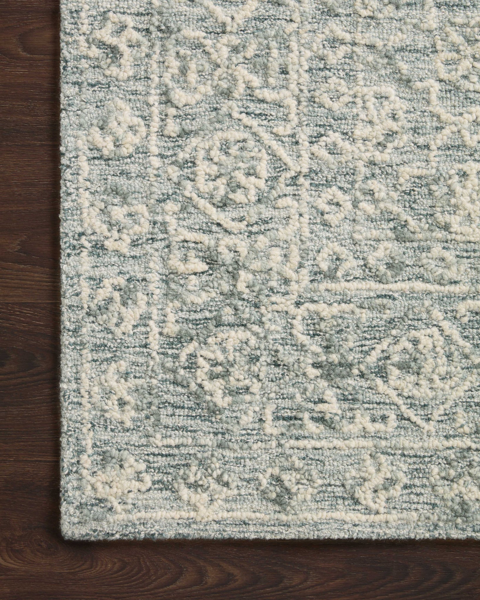 side view of Cecelia Ocean / Ivory luxury Rug