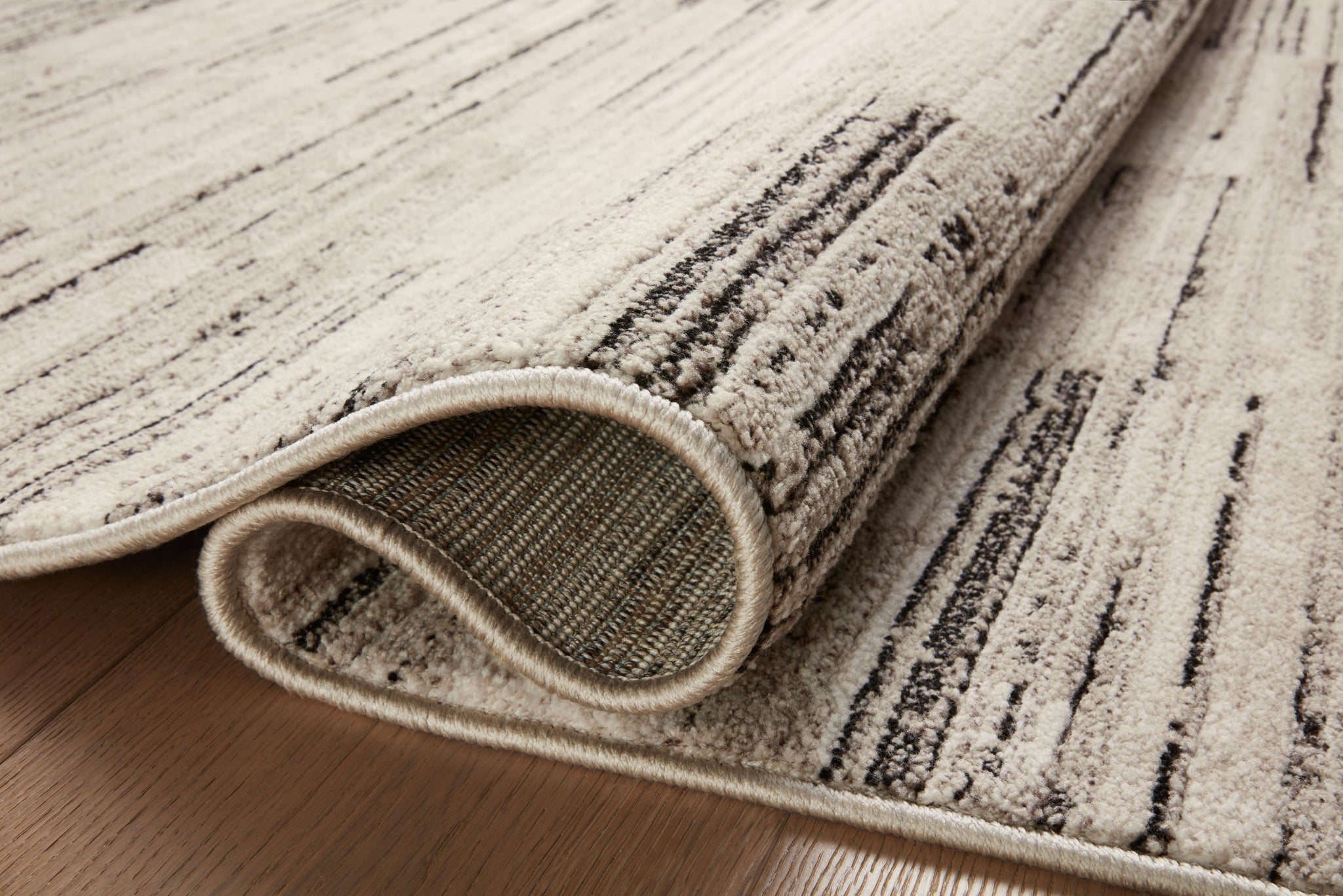 detail view of Darby Charcoal / Sand luxury Rug