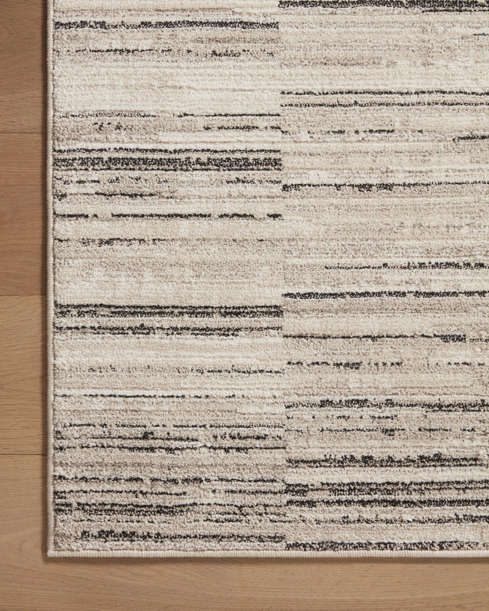 lifestyle view of Darby Charcoal / Sand luxury Rug