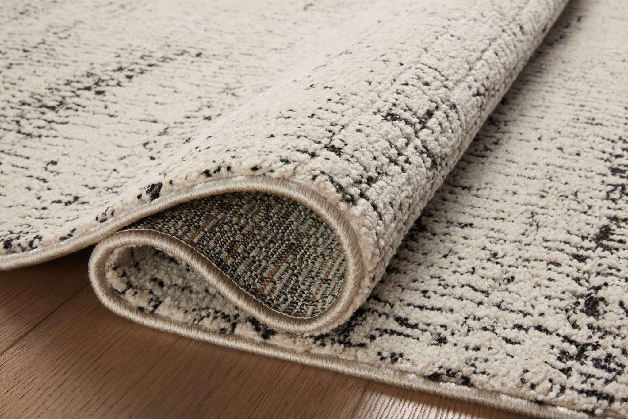 detail view of Darby Oatmeal / Charcoal luxury Rug