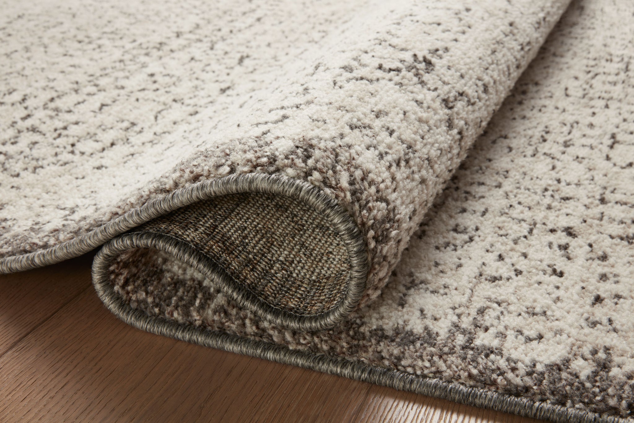 detail view of Darby Ivory / Stone luxury Rug