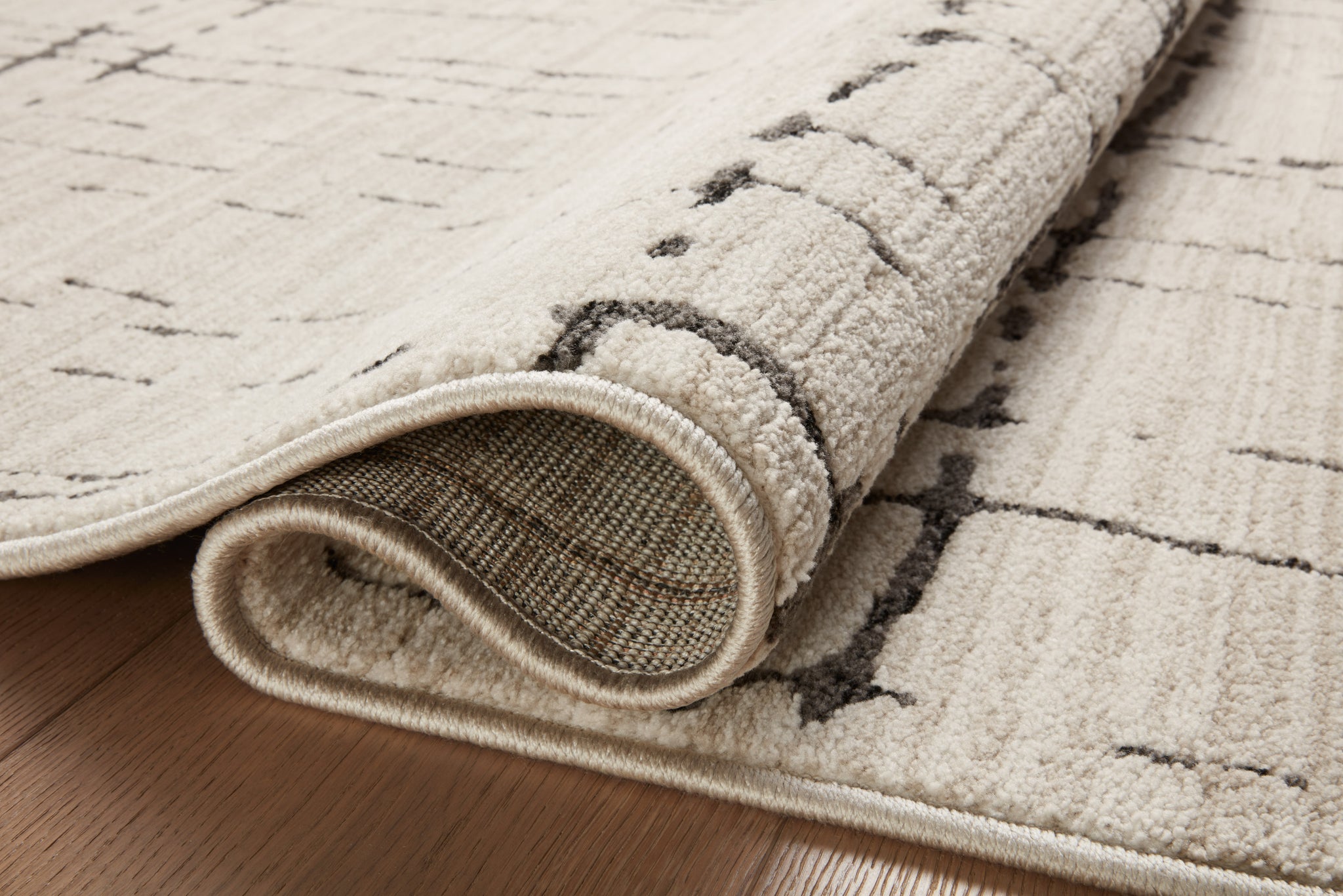 angle view of Darby Sand / Dk. Grey luxury Rug