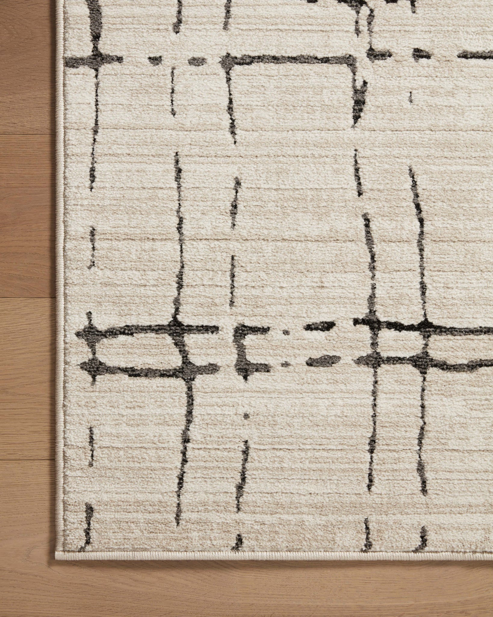 lifestyle view of Darby Sand / Dk. Grey luxury Rug