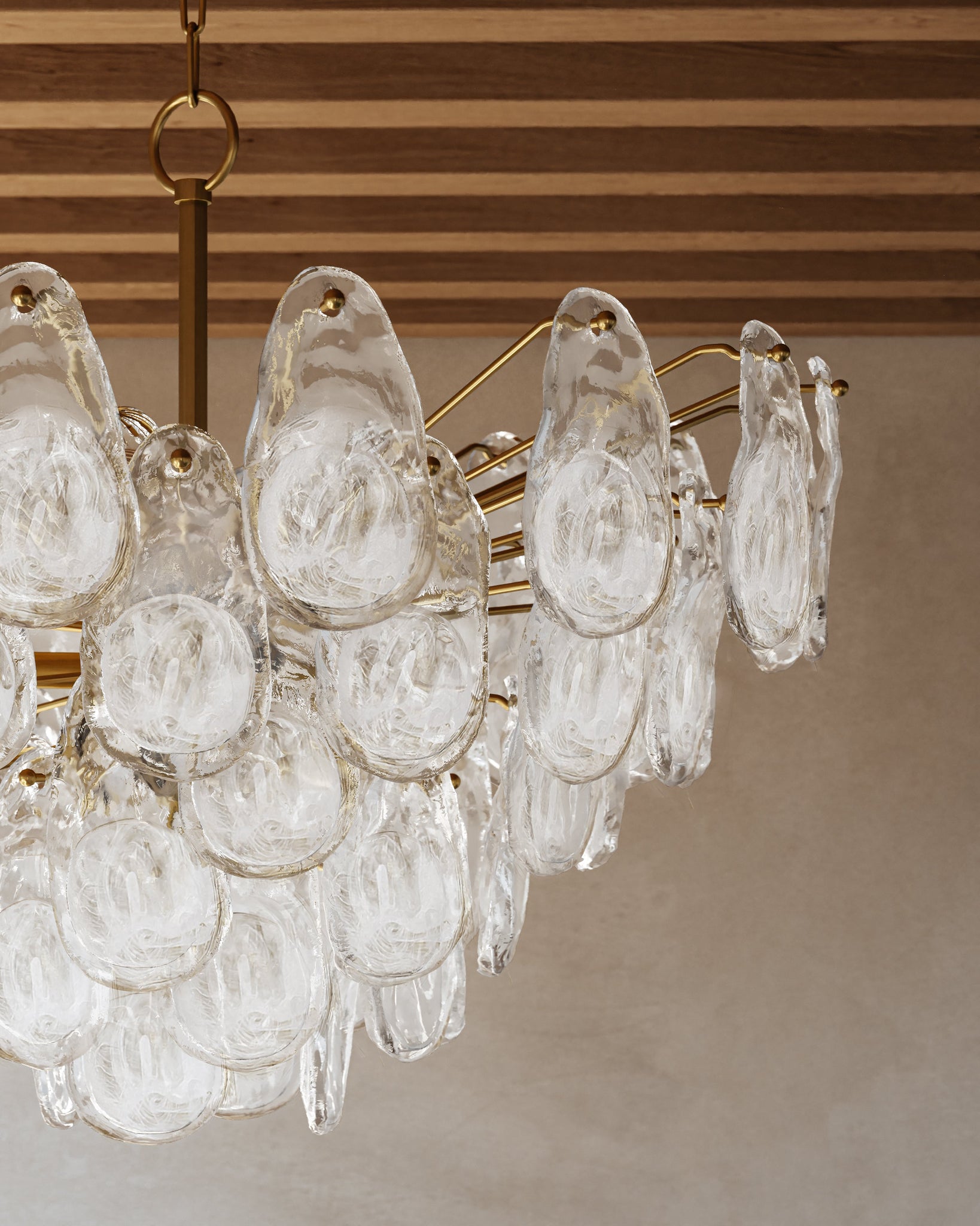 Close-up of the Darcia Chandelier 35.75" in aged brass showing the frame, arms, and shade detail.