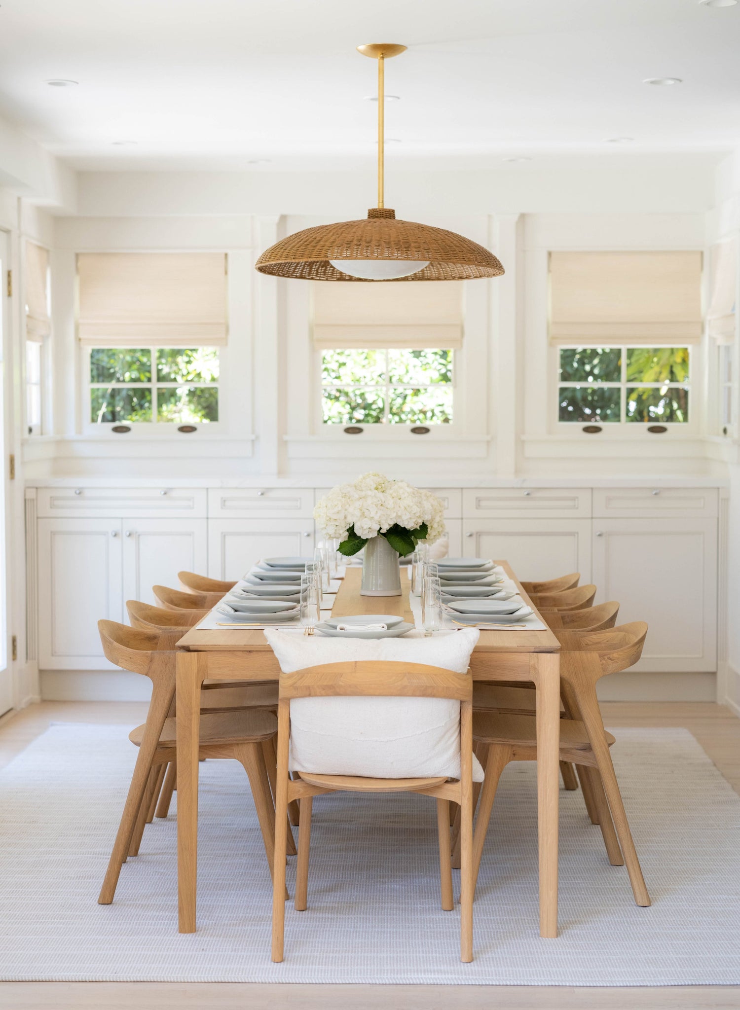 Delano Pendant 32.5" styled in a bright kitchen for warm, layered light at Laurie Yapp Home.