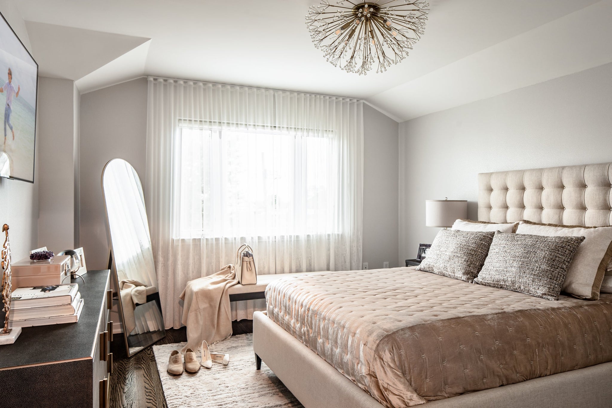 Dunkirk Semi Flush 30" in aged brass styled in a hallway for warm, layered light at Laurie Yapp Home.
