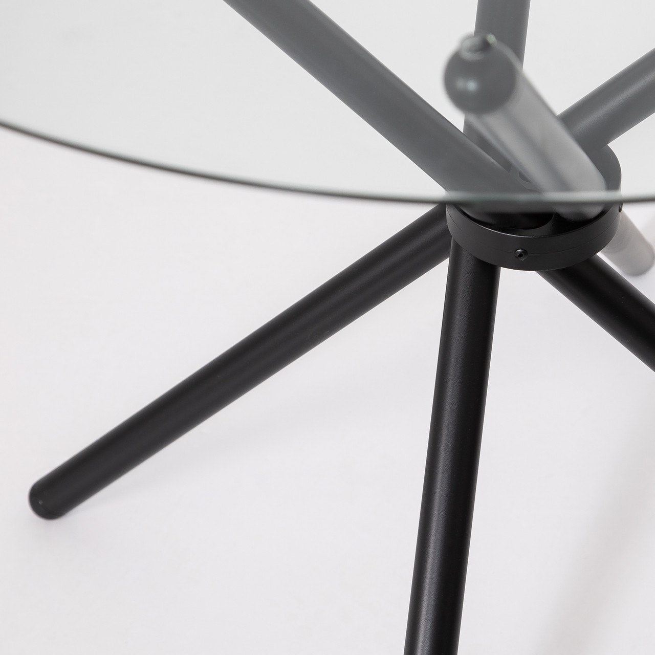 Close-up of a gray metal chair base on a white background