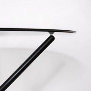 Close-up of a black metal table with a white background