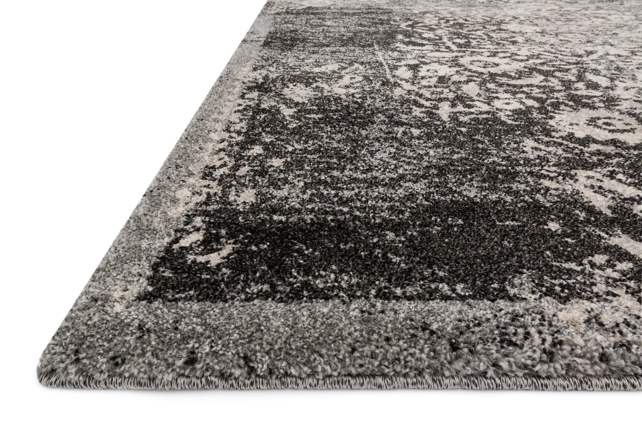 side view of Emory Black / Ivory luxury Rug