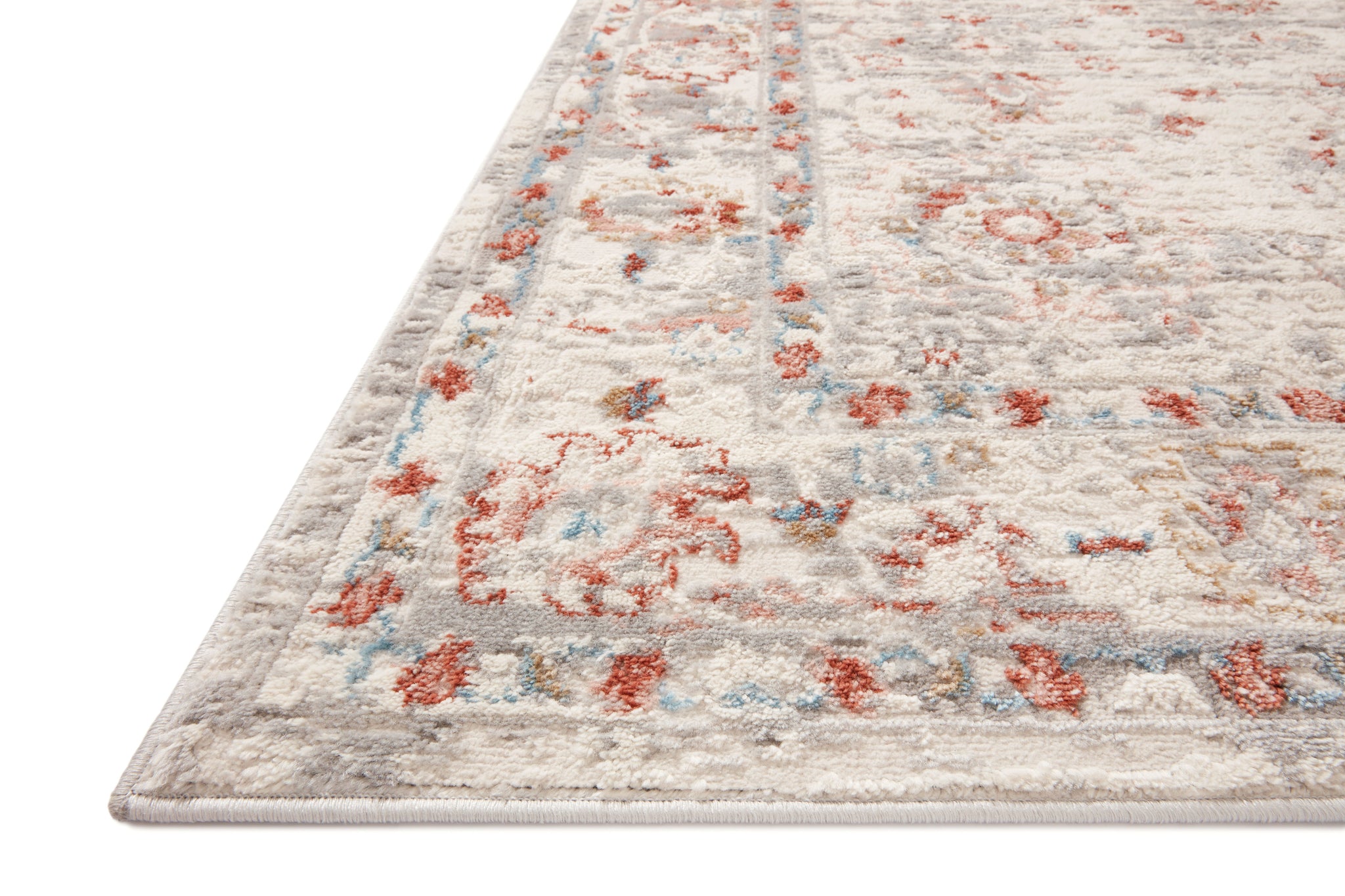 side view of Estelle Ivory / Rust luxury Rug