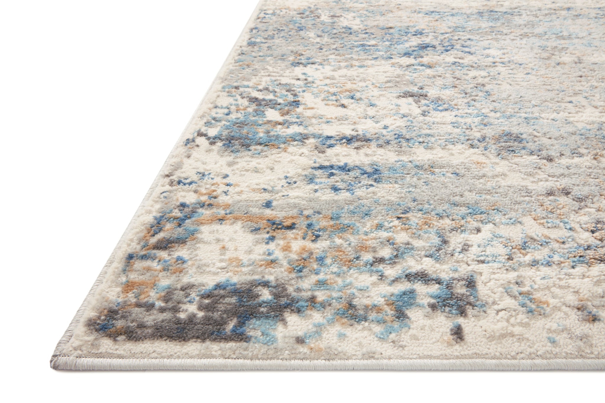 side view of Estelle Ivory / Ocean luxury Rug