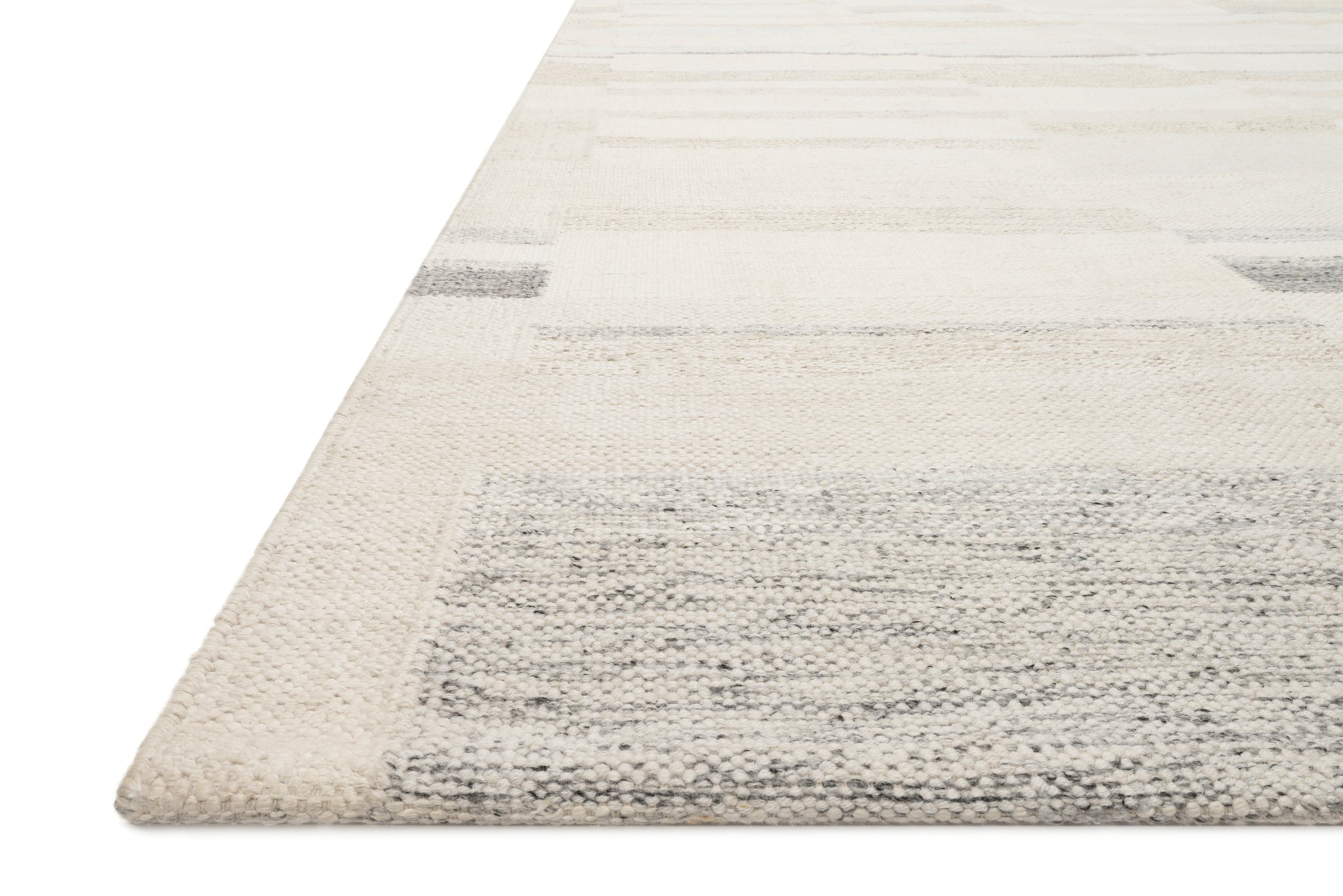 angle view of Evelina Ivory / Beige luxury Rug