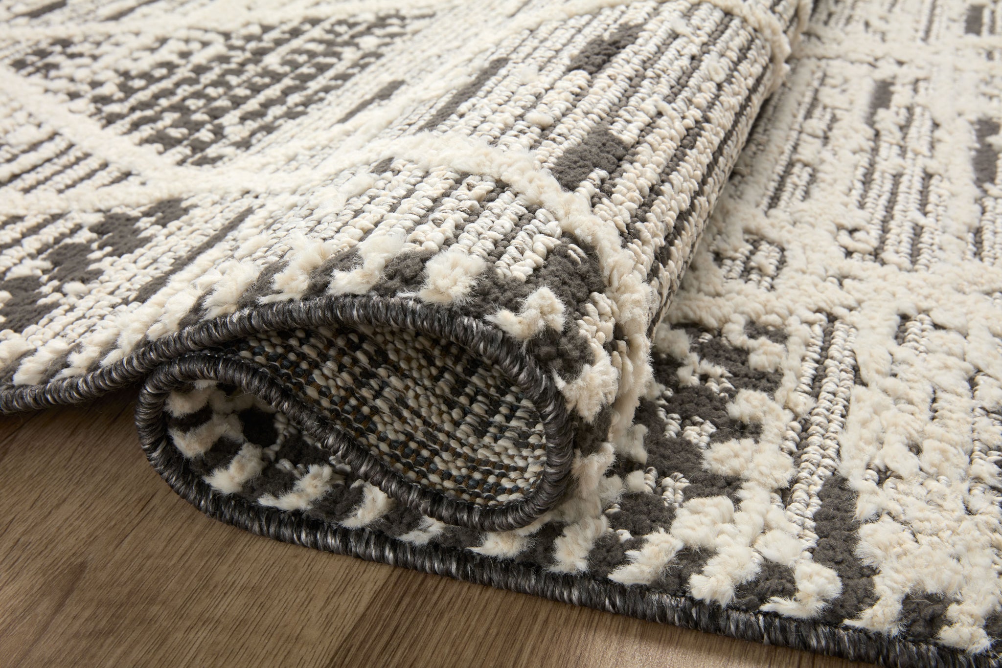 detail view of Fabian Charcoal / Ivory luxury Rug
