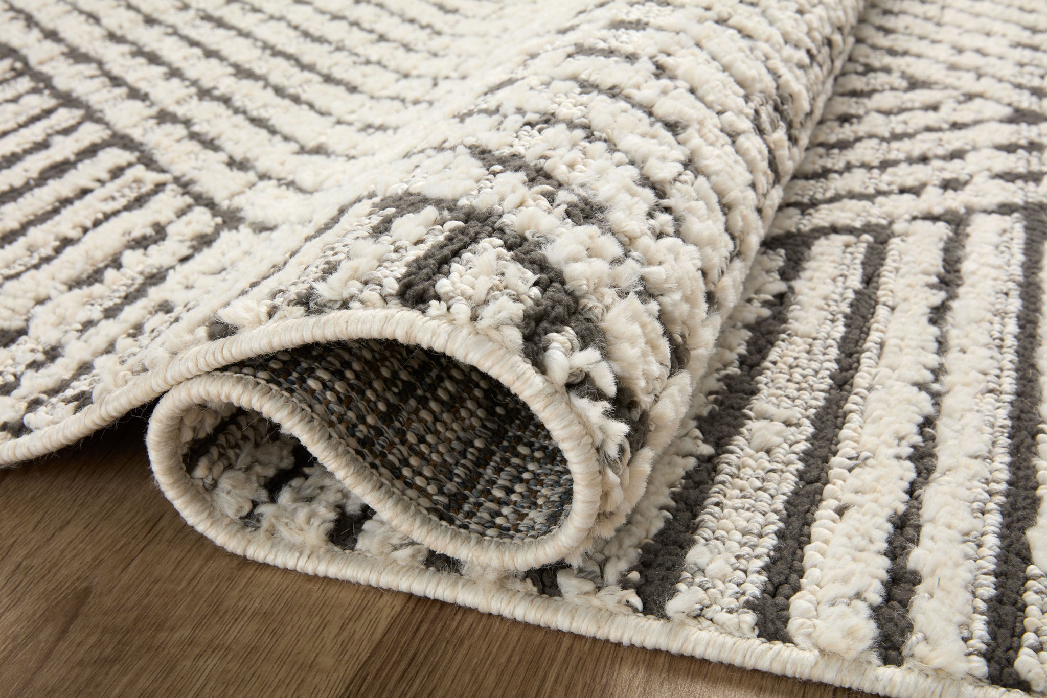 detail view of Fabian Charcoal / Ivory luxury Rug