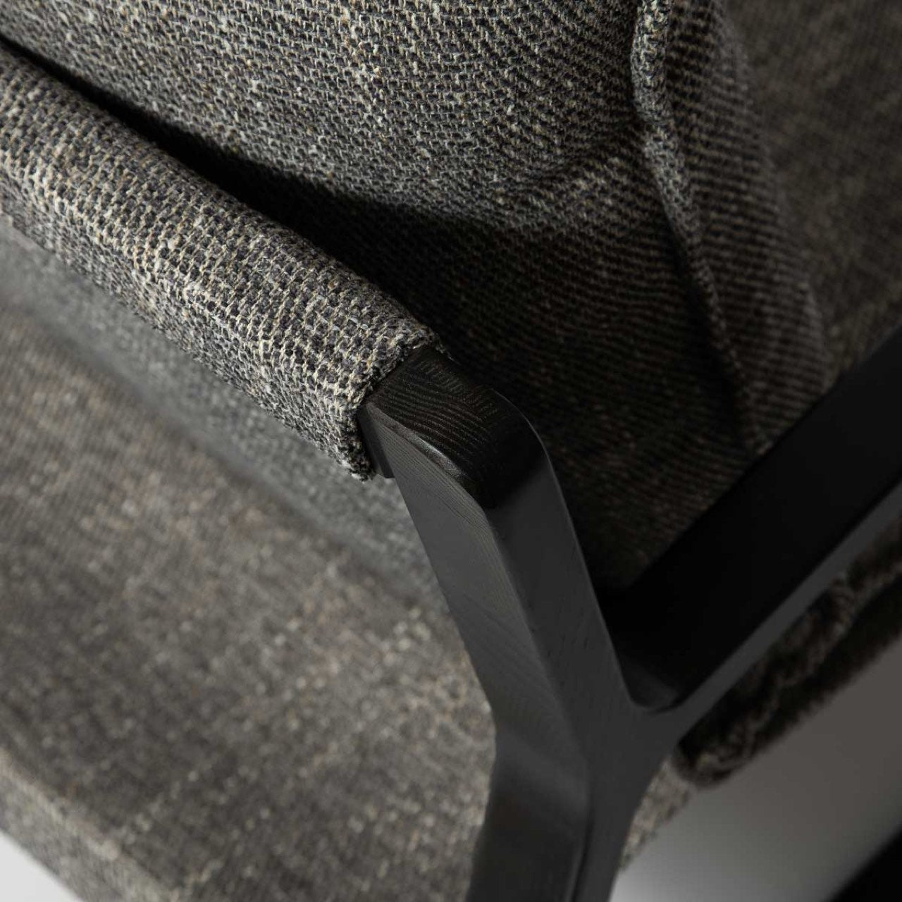 Chair with gray cushions and black frame on a white background