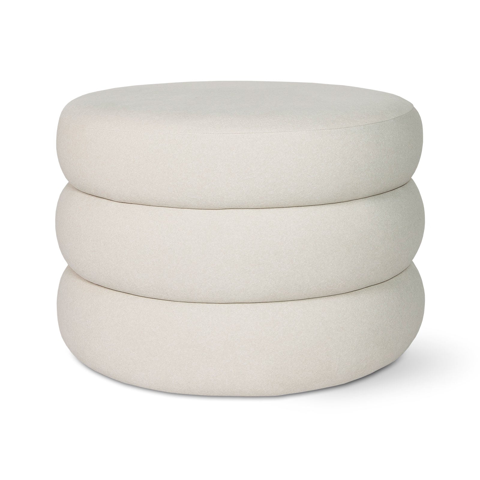 Stack of three beige ottomans on a white background