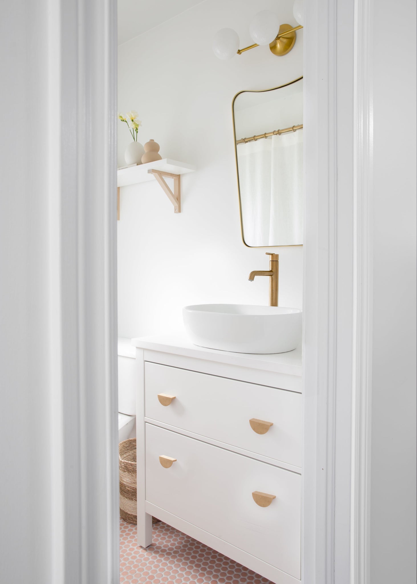 Fleming Bath And Vanity 20.75" in aged brass styled in a powder room for warm, layered light at Laurie Yapp Home.