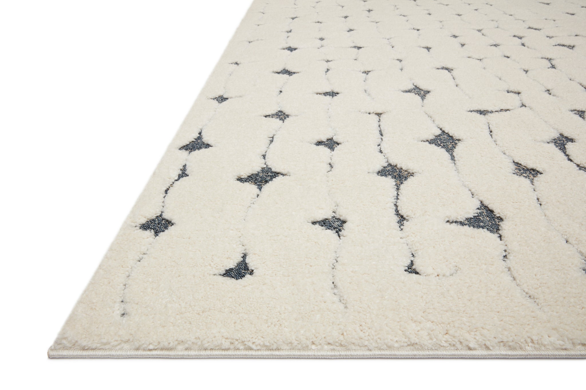 side view of Hagen White / Navy luxury Rug