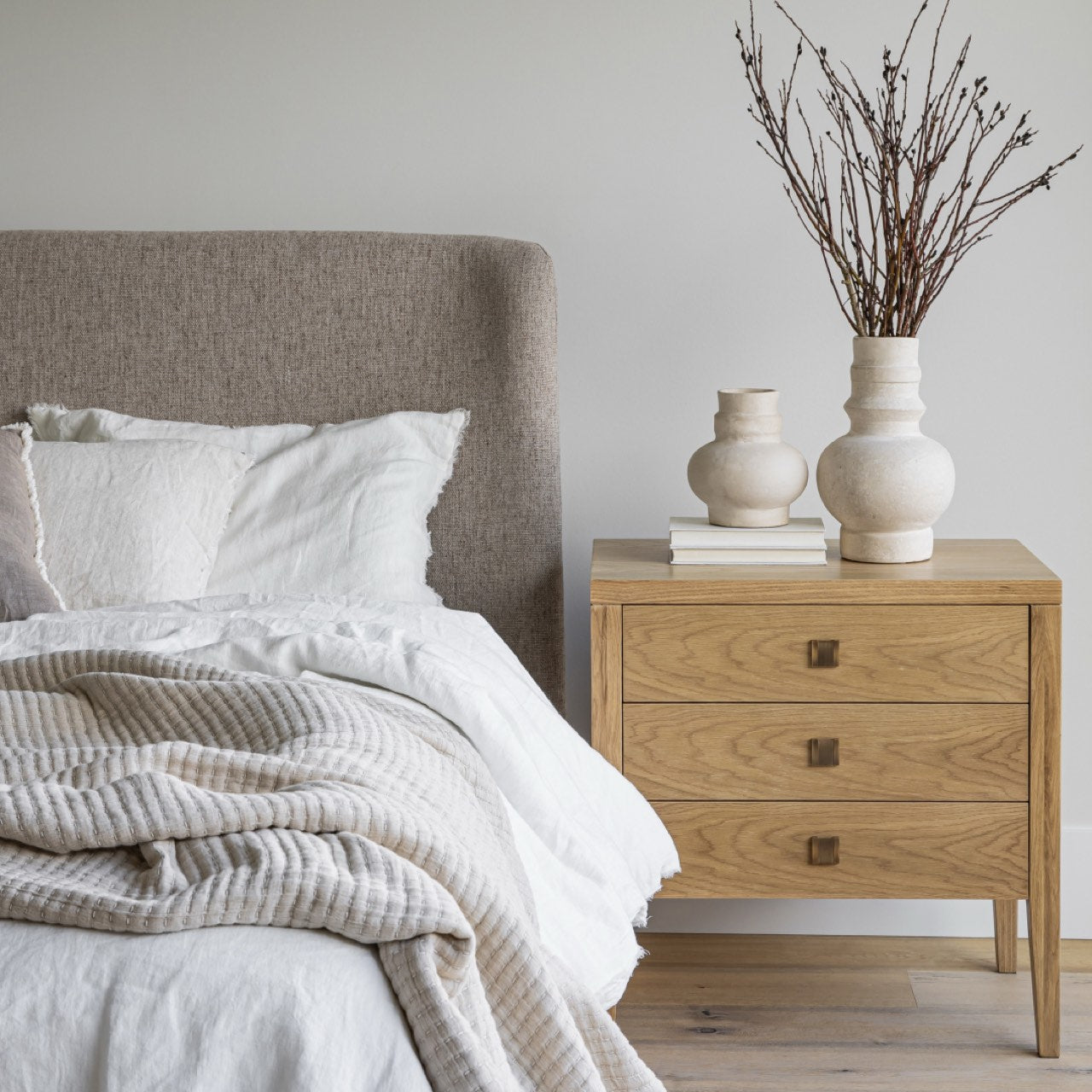 Wooden dresser with three drawers on a white background
