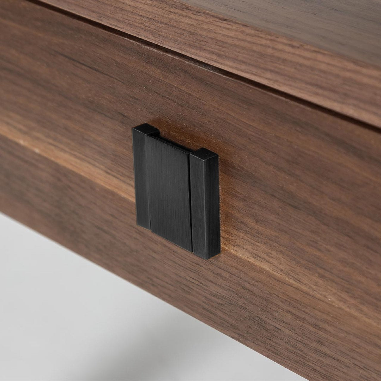 Wooden side table with a drawer on a white background