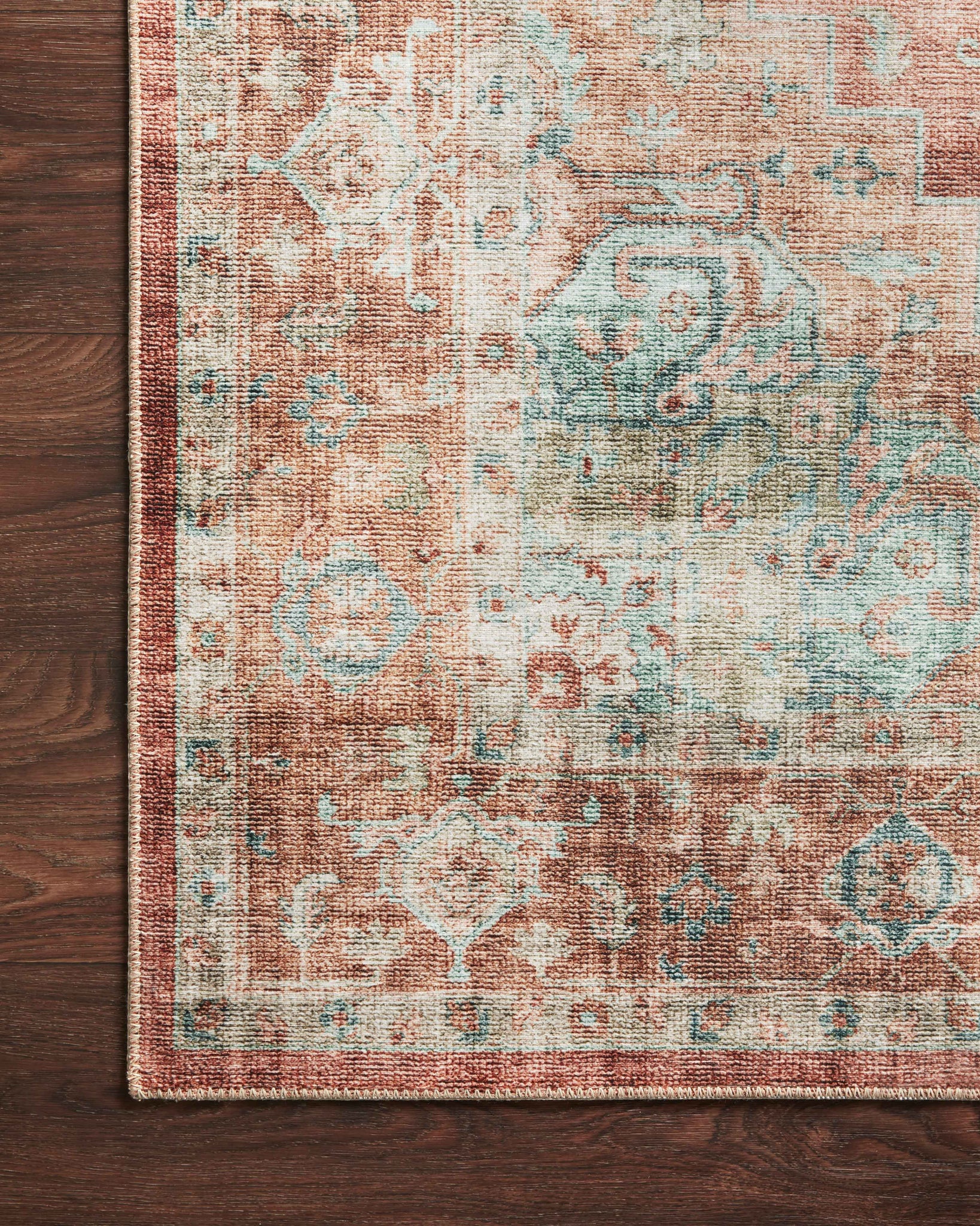 lifestyle view of Heidi Terracotta / Aqua luxury Rug