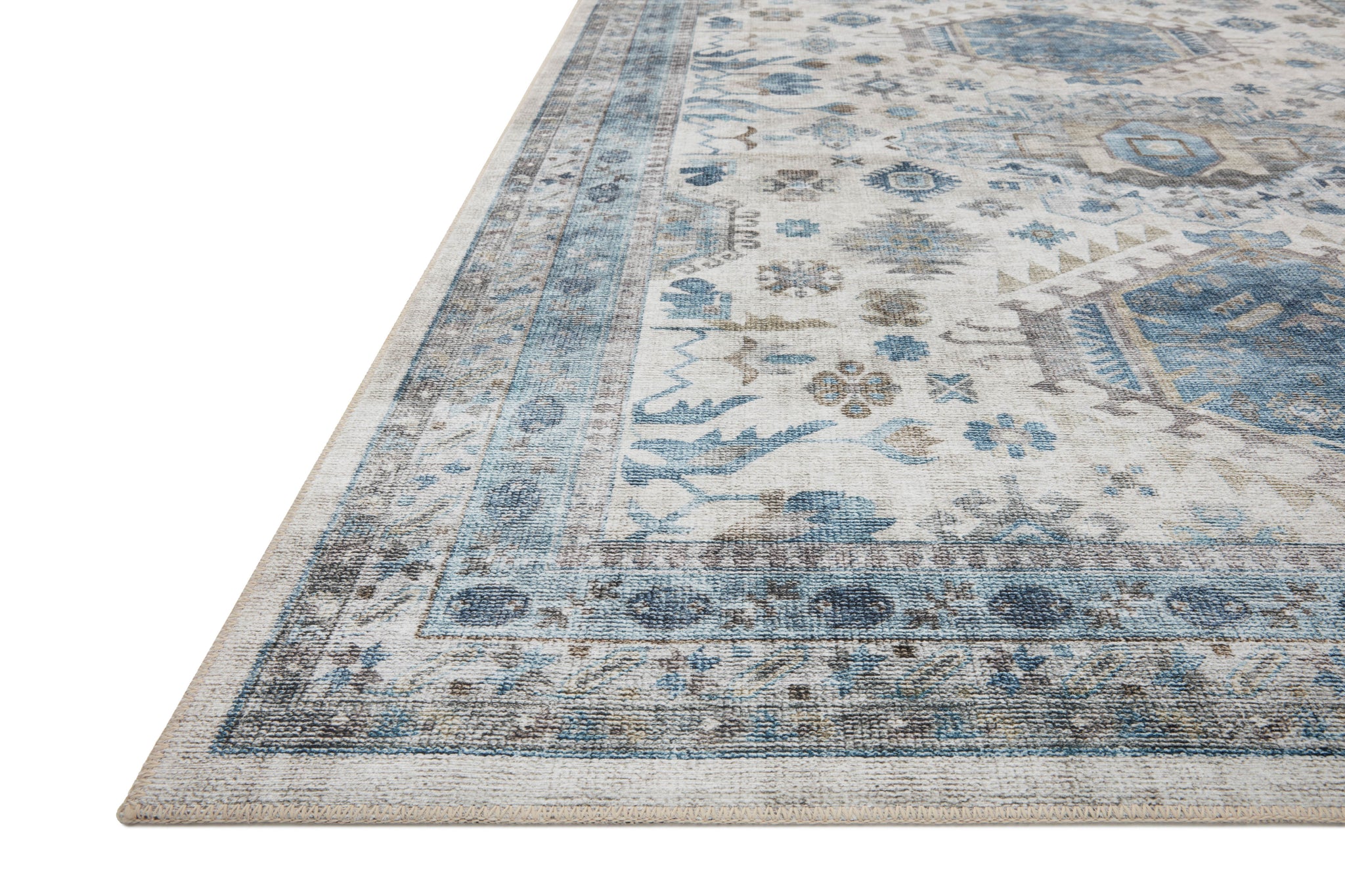 side view of Heidi Ivory / Ocean luxury Rug