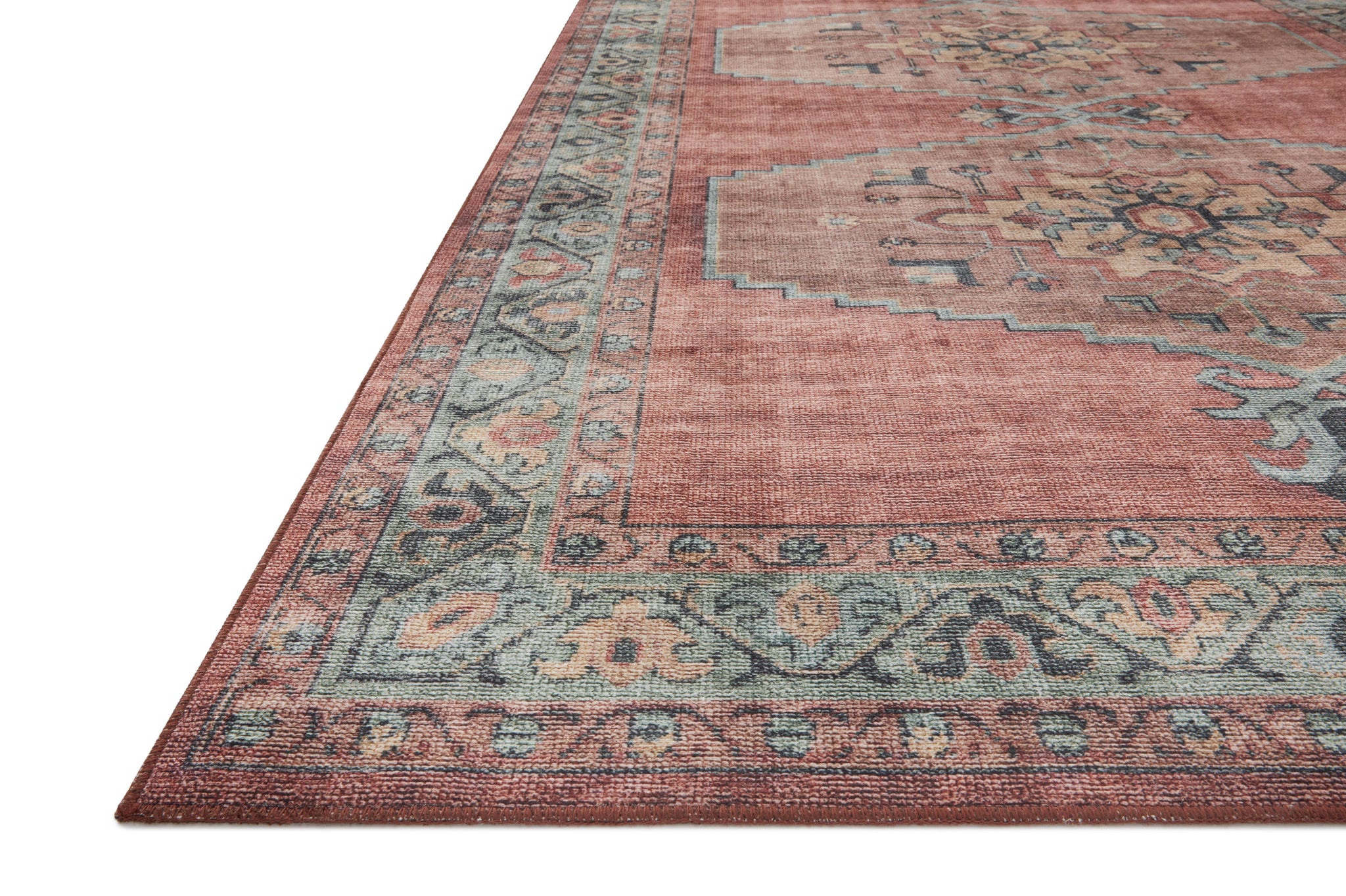 side view of Heidi Spice / Aqua luxury Rug