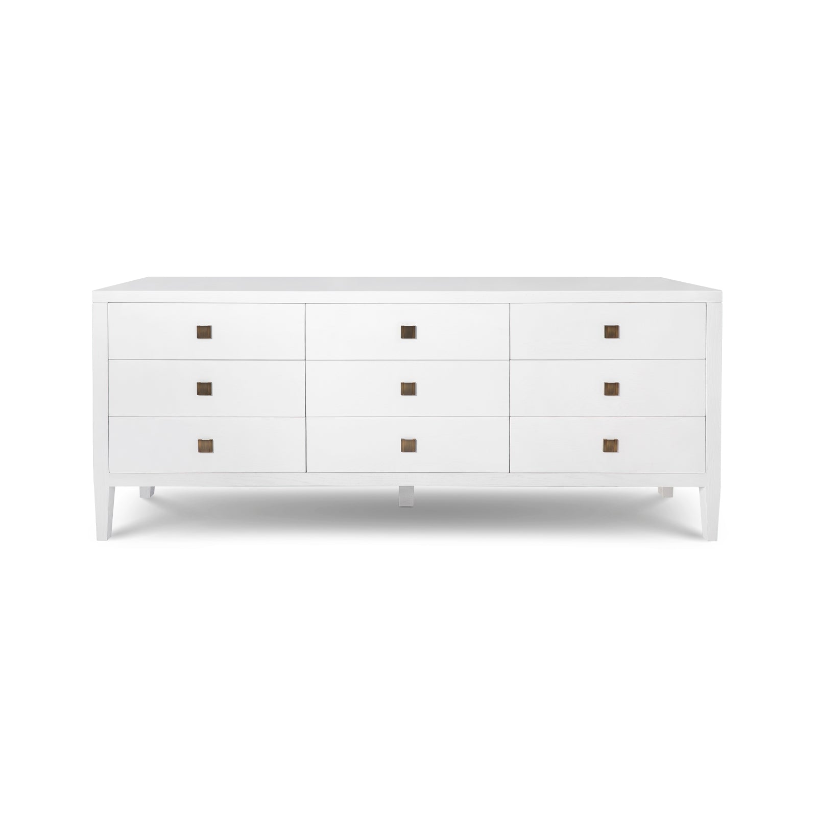 White dresser with brown knobs on a white background