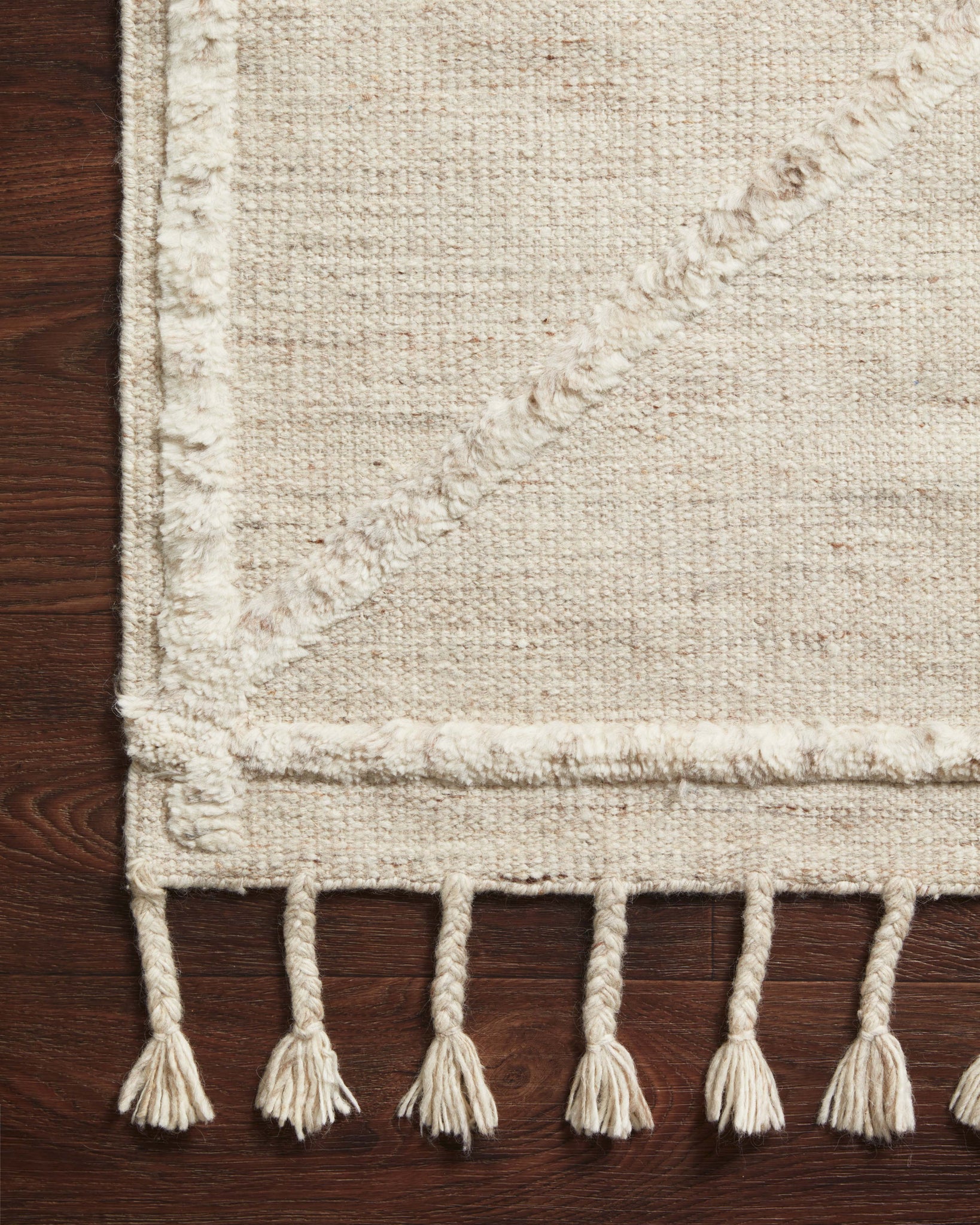 side view of Iman Beige / Ivory luxury Rug