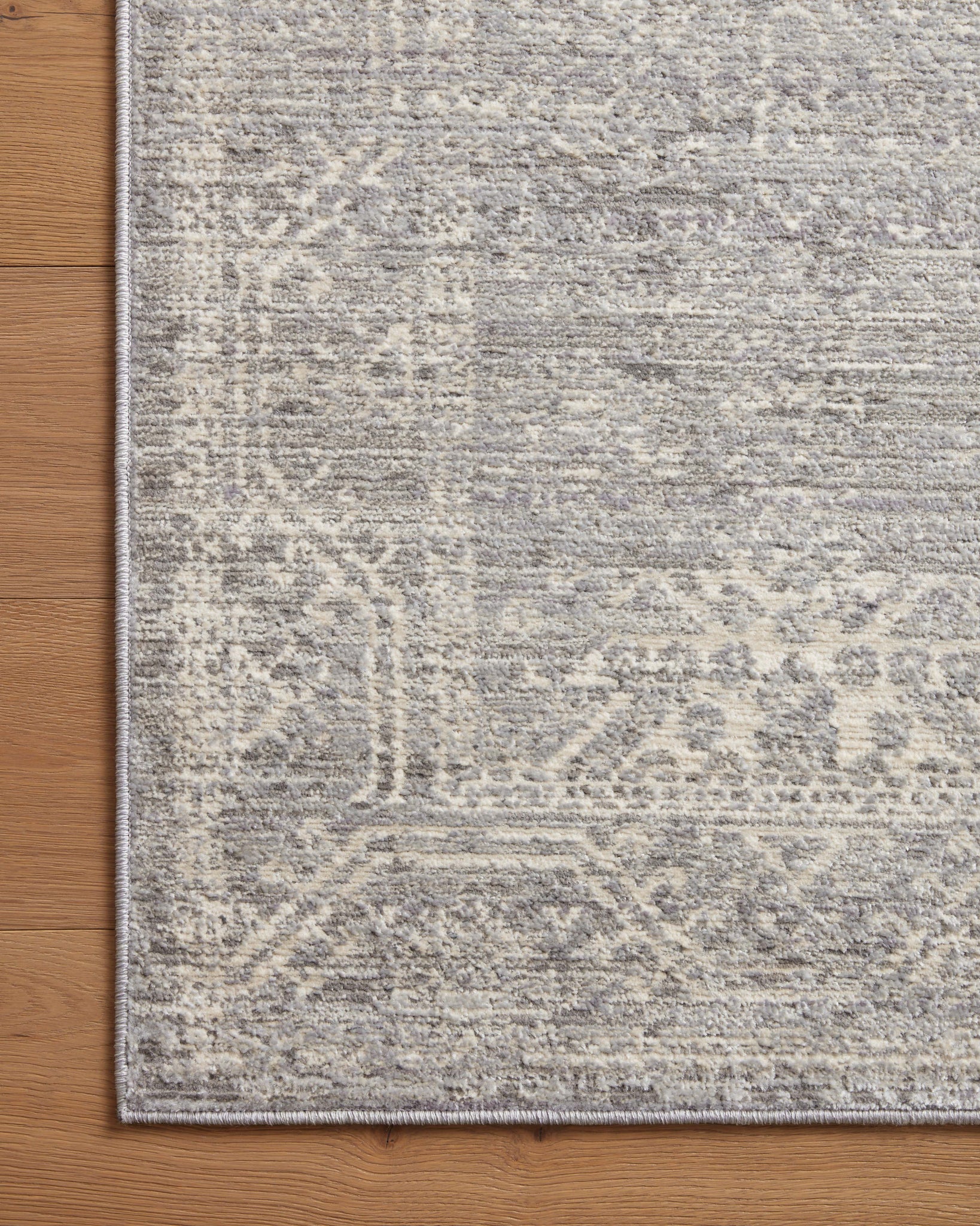side view of Indra Silver / Ivory luxury Rug