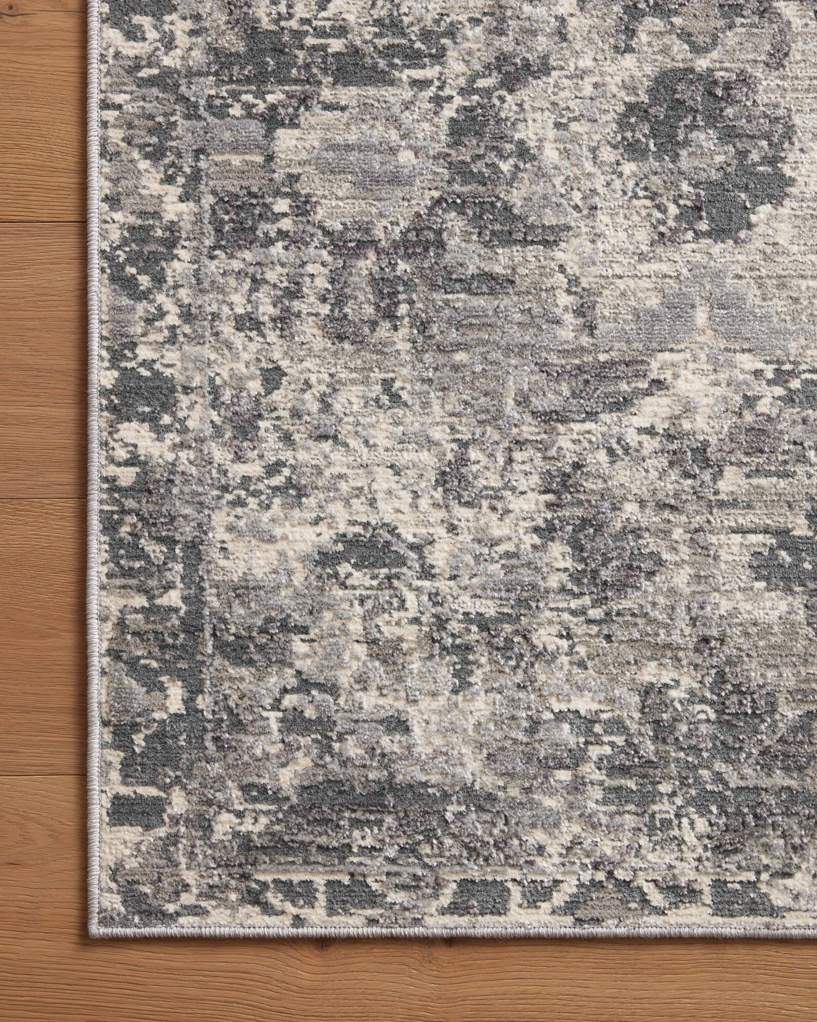 side view of Indra Charcoal / Silver luxury Rug