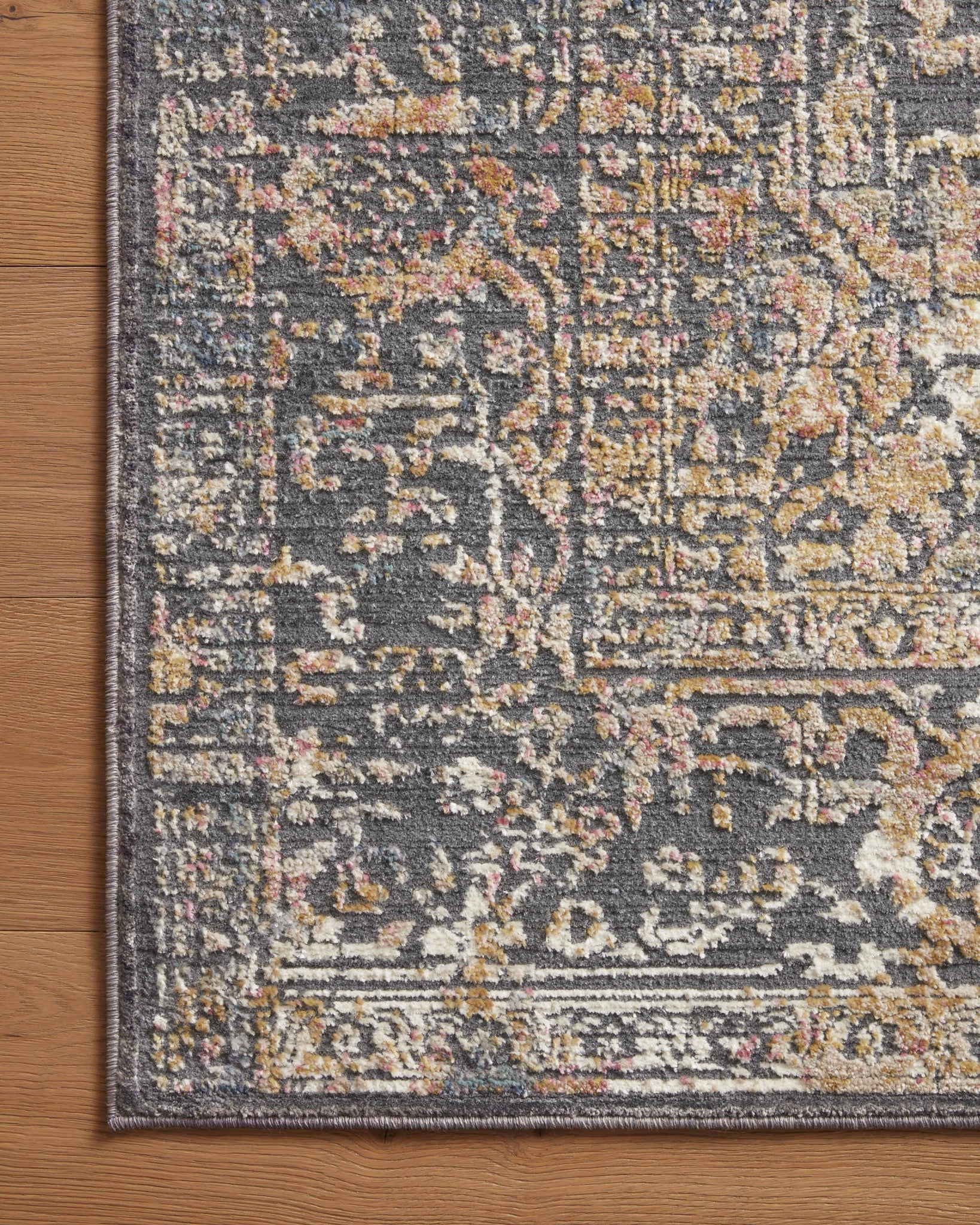 side view of Indra Graphite / Sunset luxury Rug