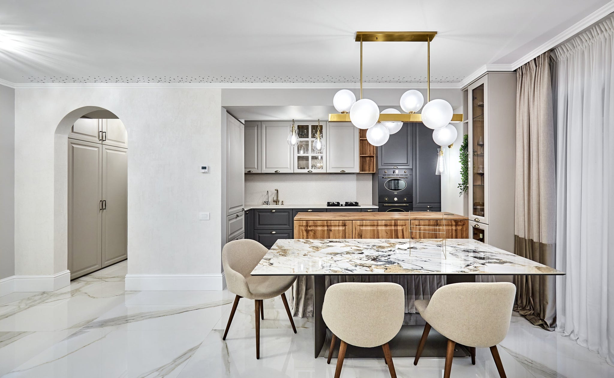 Ivy Pendant 12.5" in aged brass styled in an elegant dining room for warm, layered light at Laurie Yapp Home.