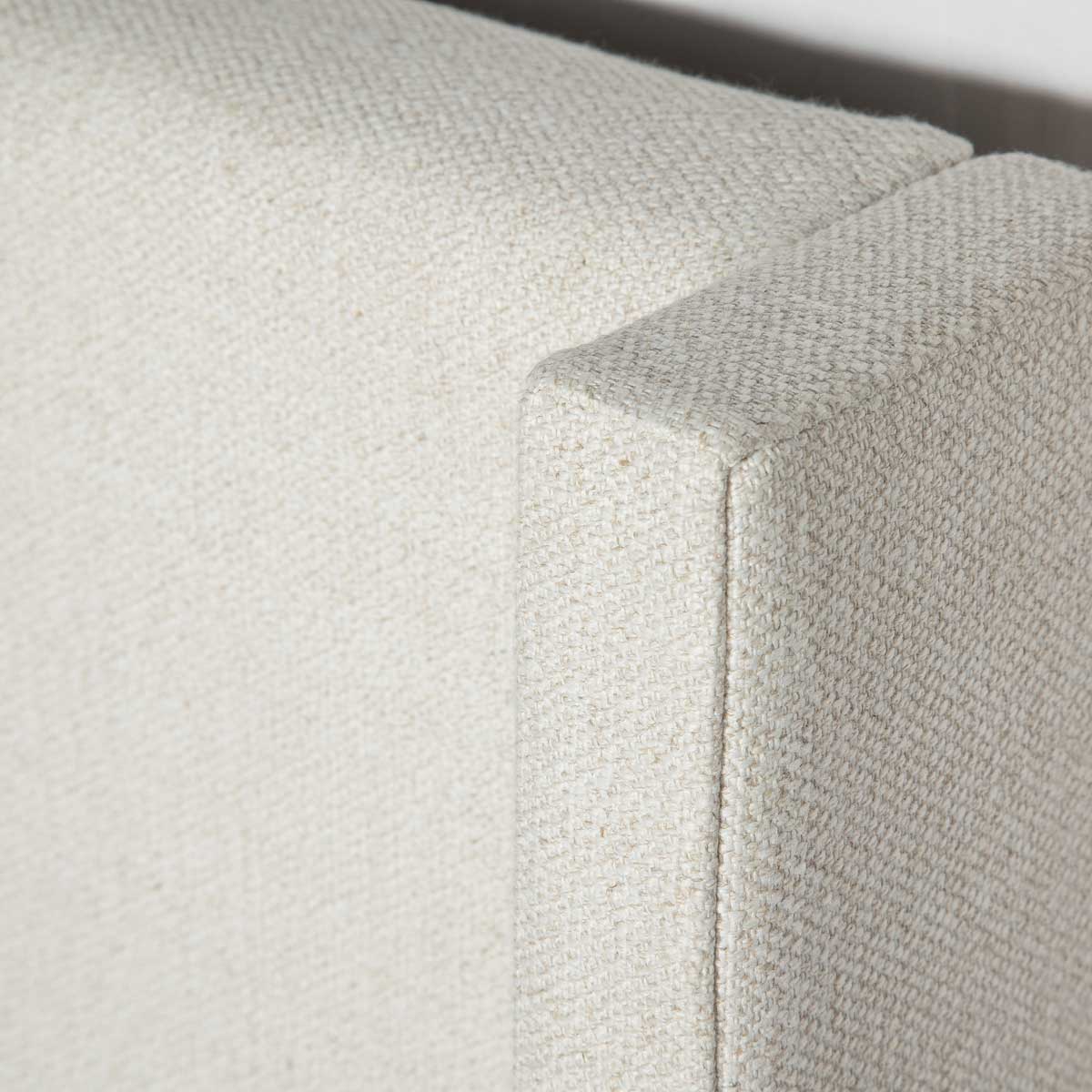 White upholstered bed with storage compartment on a white background