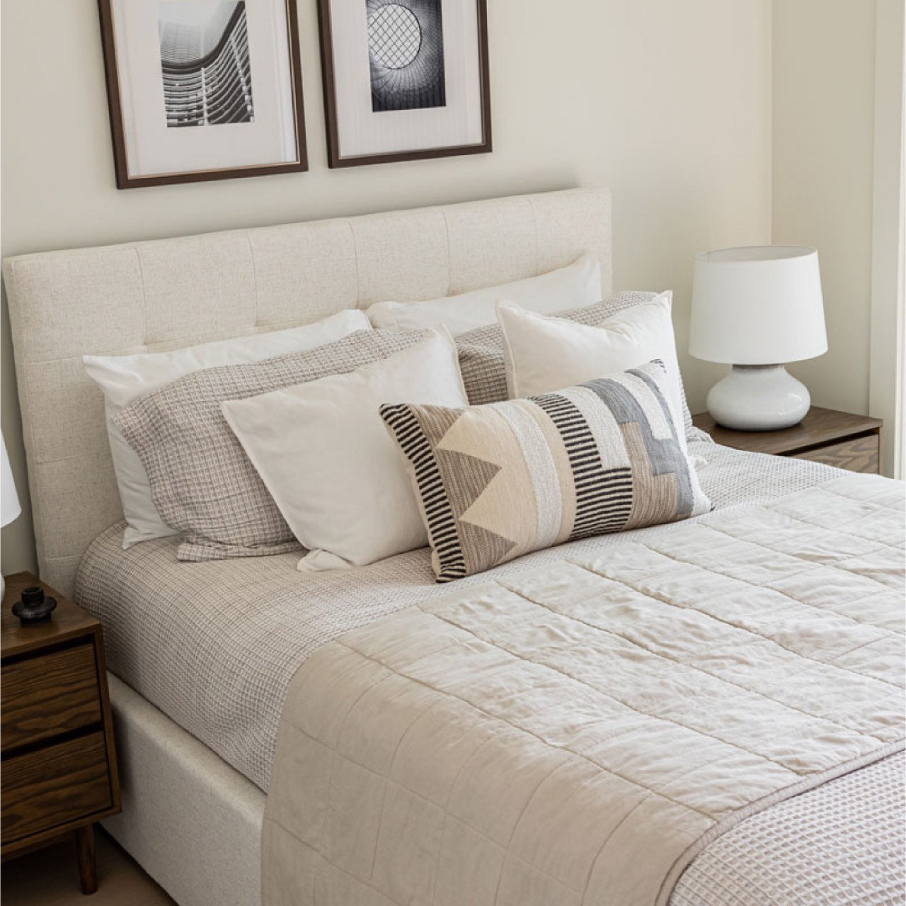 Cream bed with open storage compartment on a white background